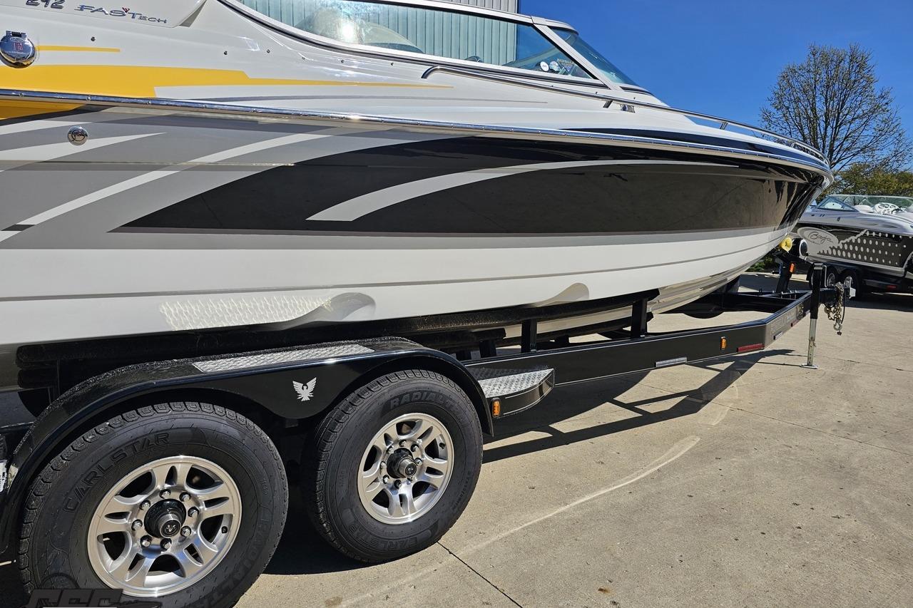 2014 Formula 292 FASTech boat on trailer, sleek design with vibrant graphics.