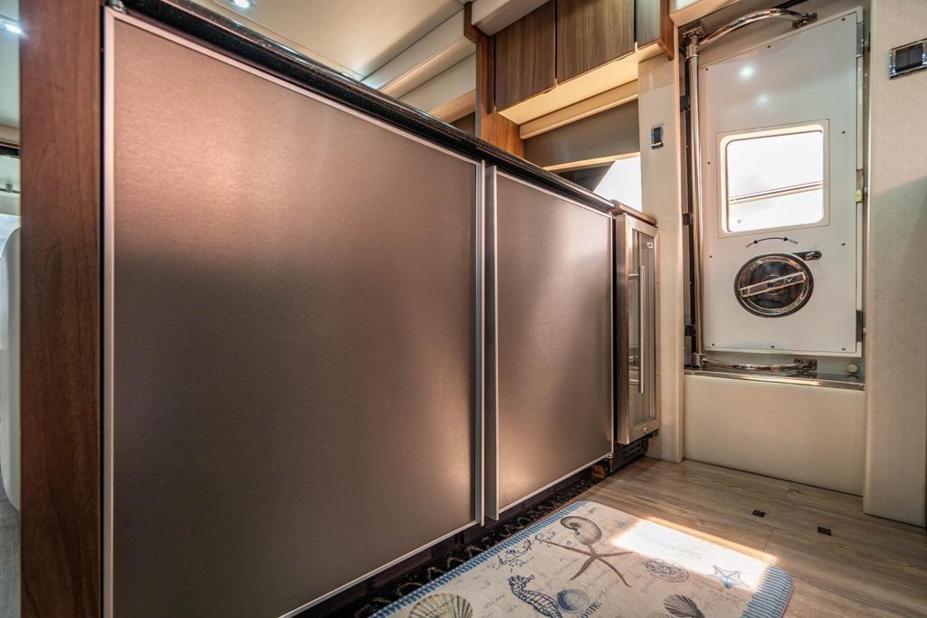 Interior of 2020 Fairline 68 yacht, featuring sleek cabinetry and modern design elements.