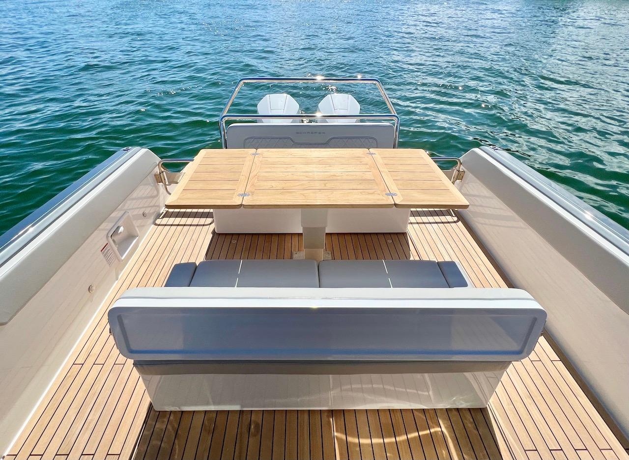 Schaefer V33 2027 yacht with elegant wooden deck and seating area.