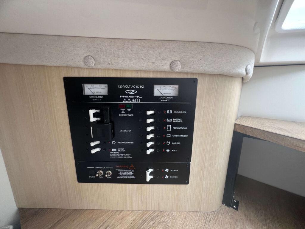 Electrical panel of 2025 Regal 33 OBX boat, featuring various switches and controls.