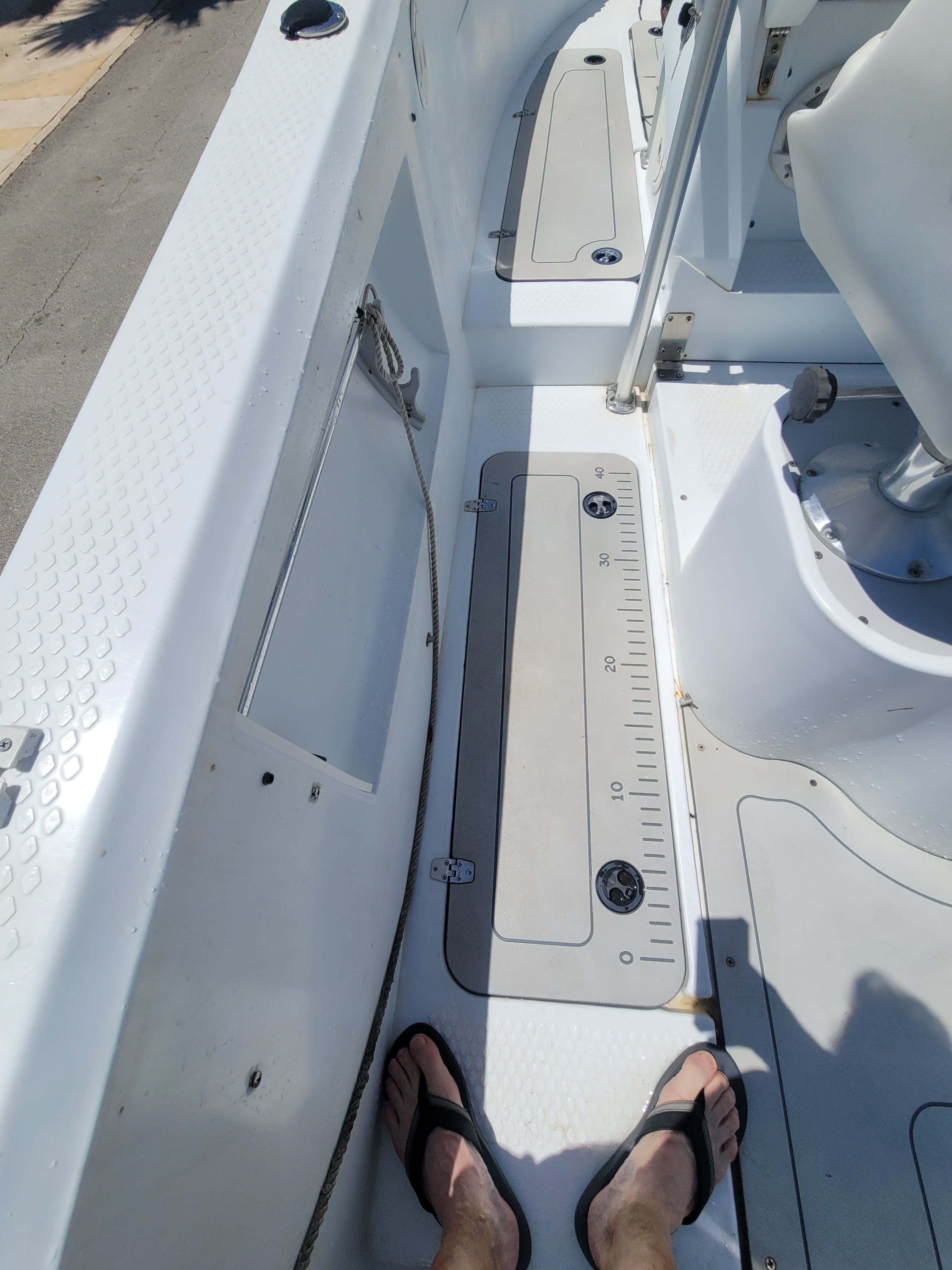 View of a 2005 Triumph VS deck with storage compartments and a rope.