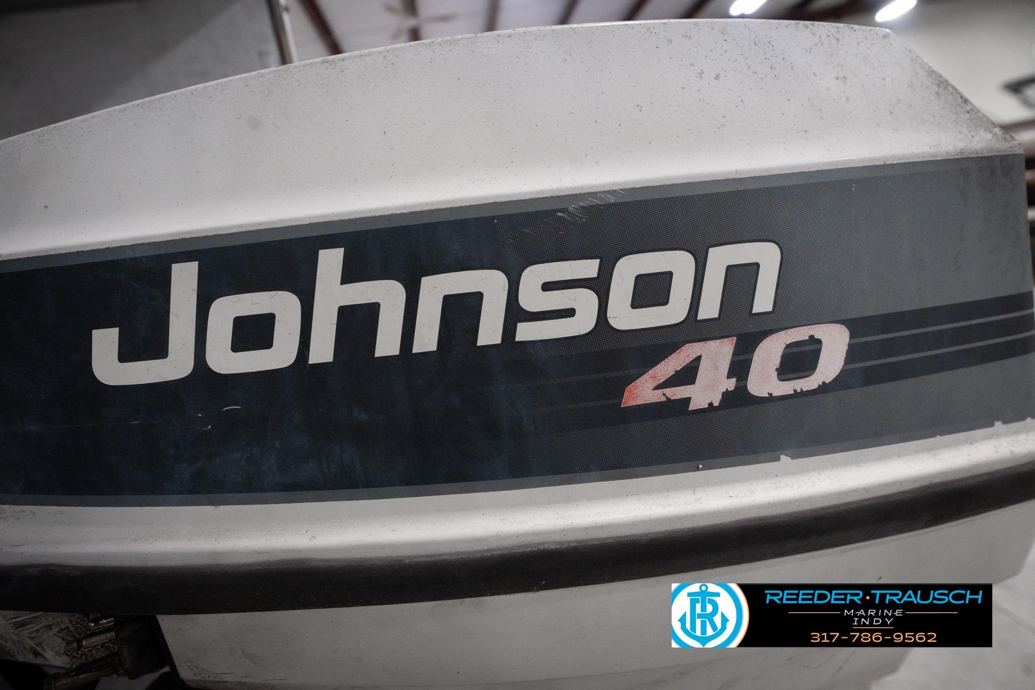 Outboard motor labeled "Johnson 40" on a 1992 Godfrey Sweetwater boat.