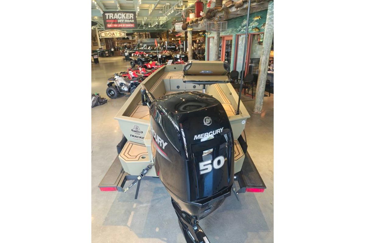 2026 Tracker Grizzly 1650 T Prairie Wings Edition boat with Mercury 50 engine in showroom.