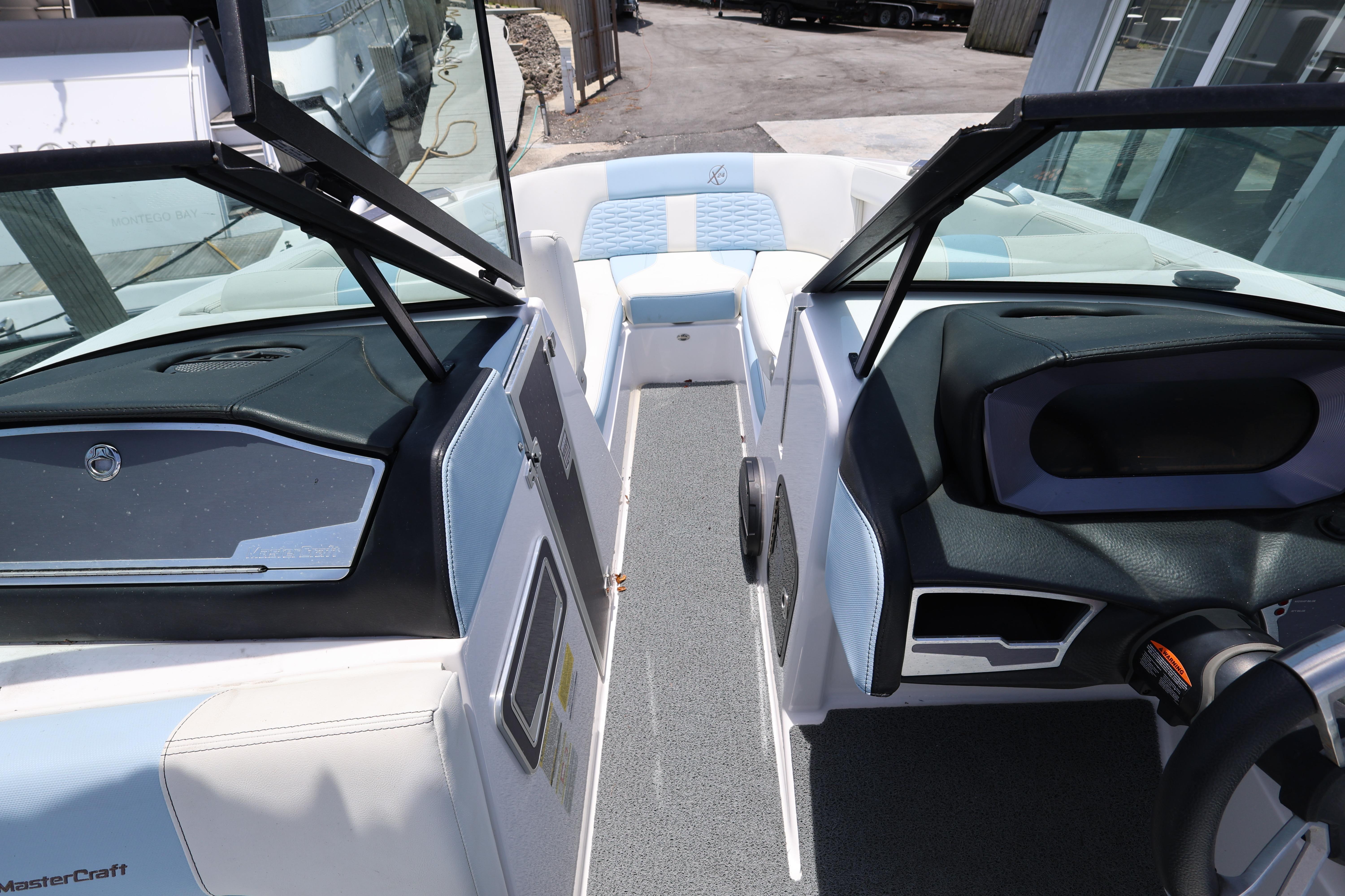 2023 MasterCraft X24 boat interior with modern dashboard and seating.