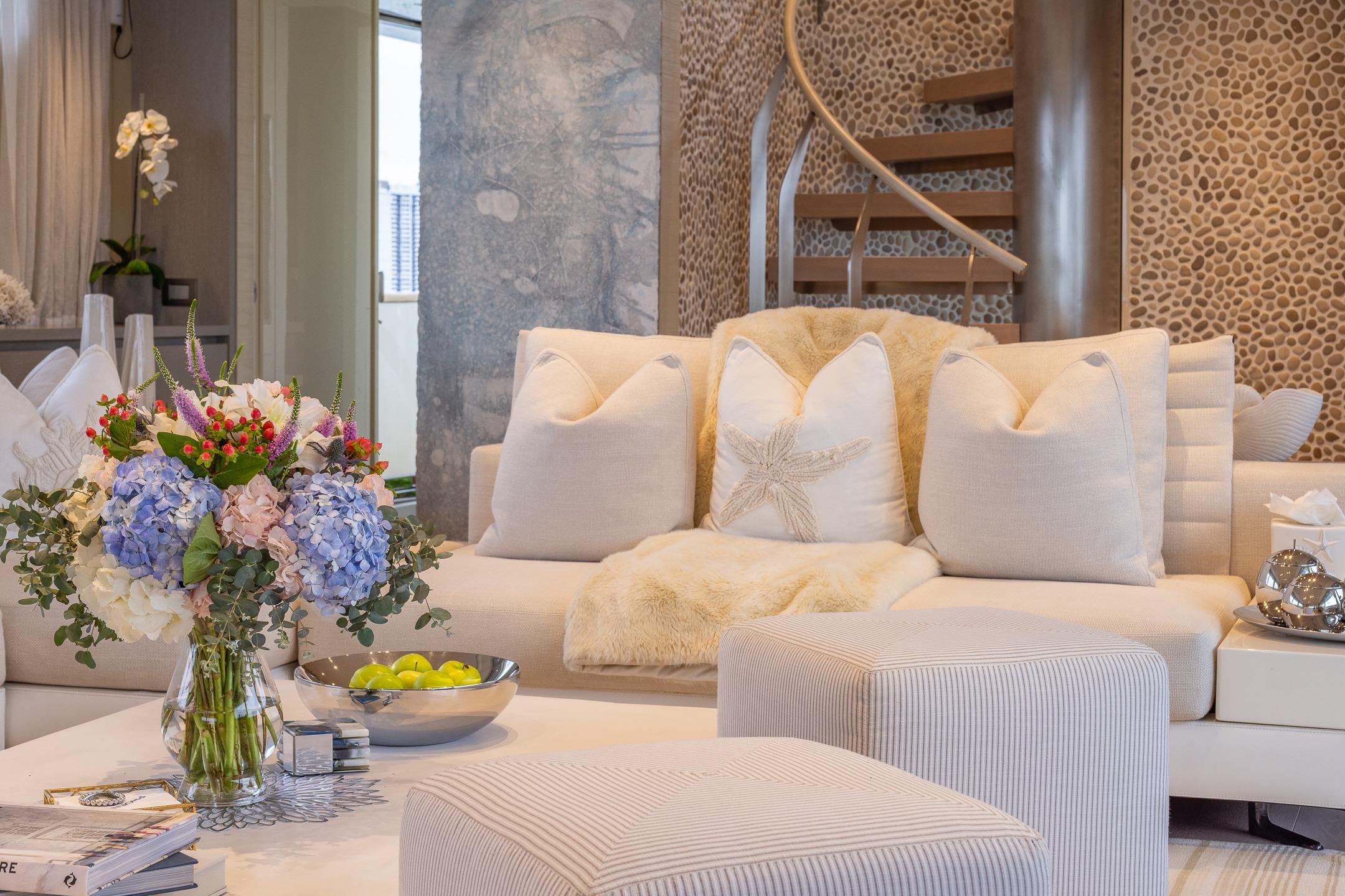 Luxurious Sanlorenzo SD112 yacht interior with elegant decor and floral arrangement, 2019 model.