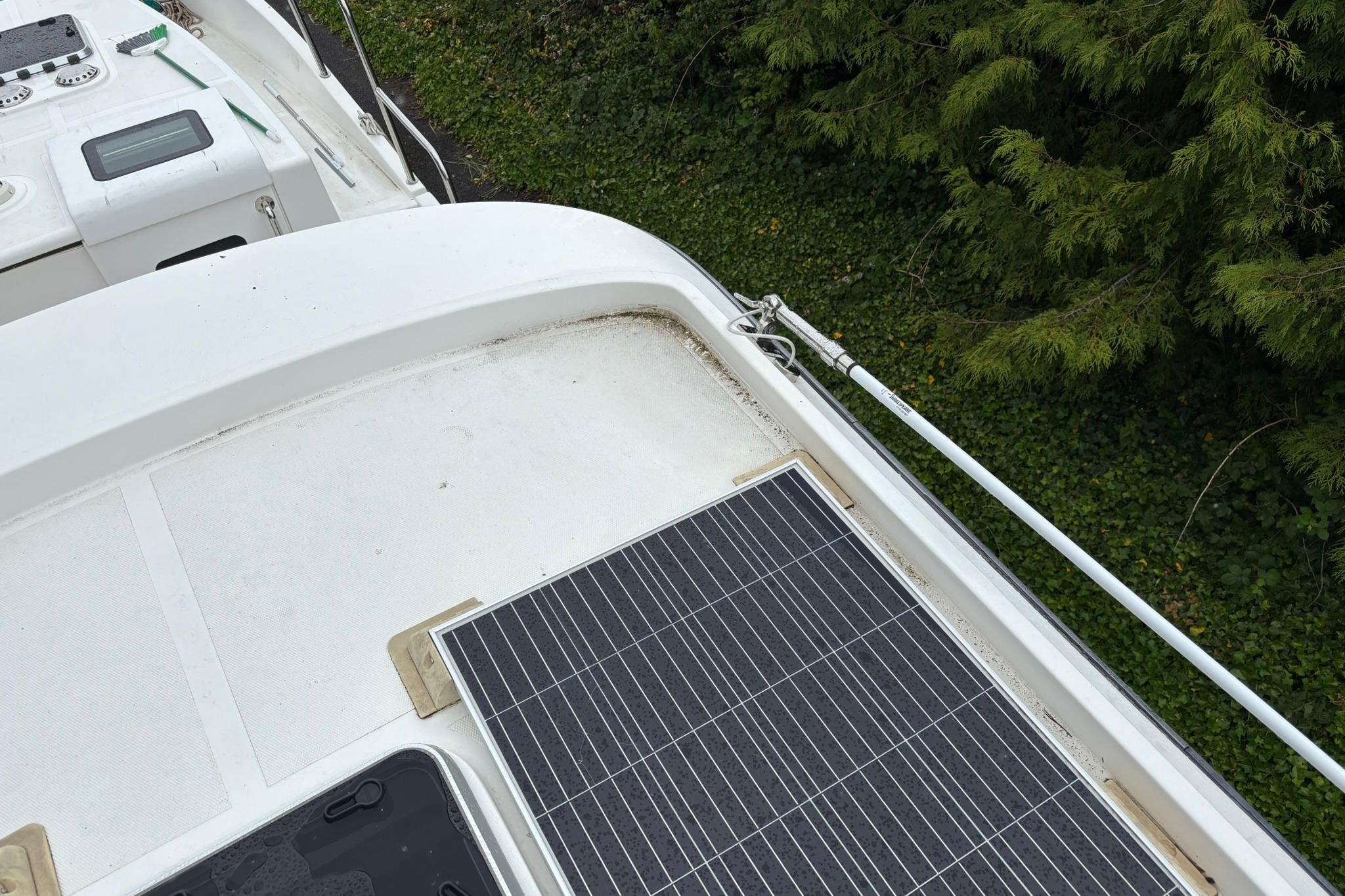 Solar panel on 2020 SeaPiper 35 boat deck, surrounded by greenery.