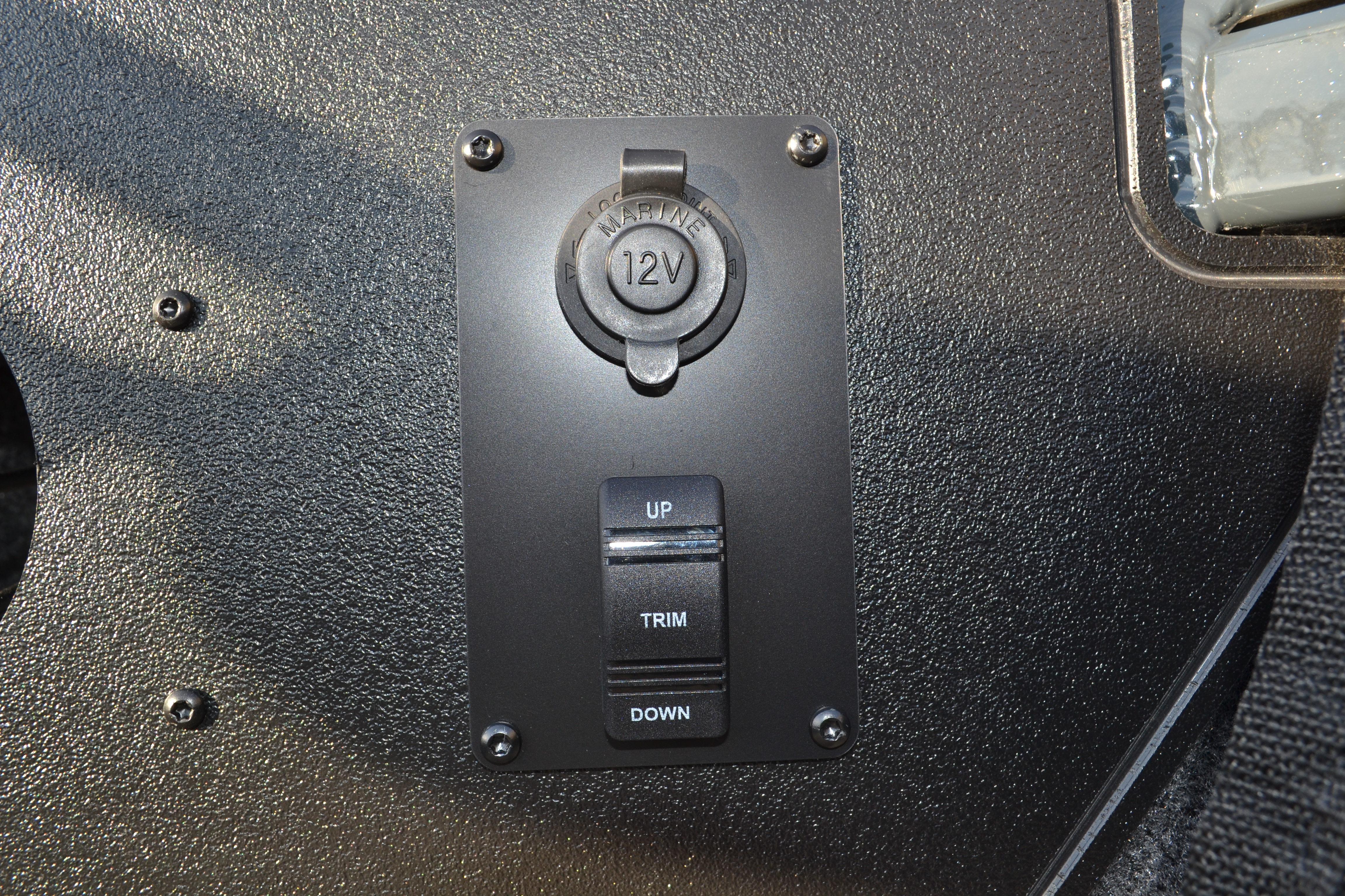 12V power outlet and trim control on 2026 Ranger VS1882SC Reata boat dashboard.