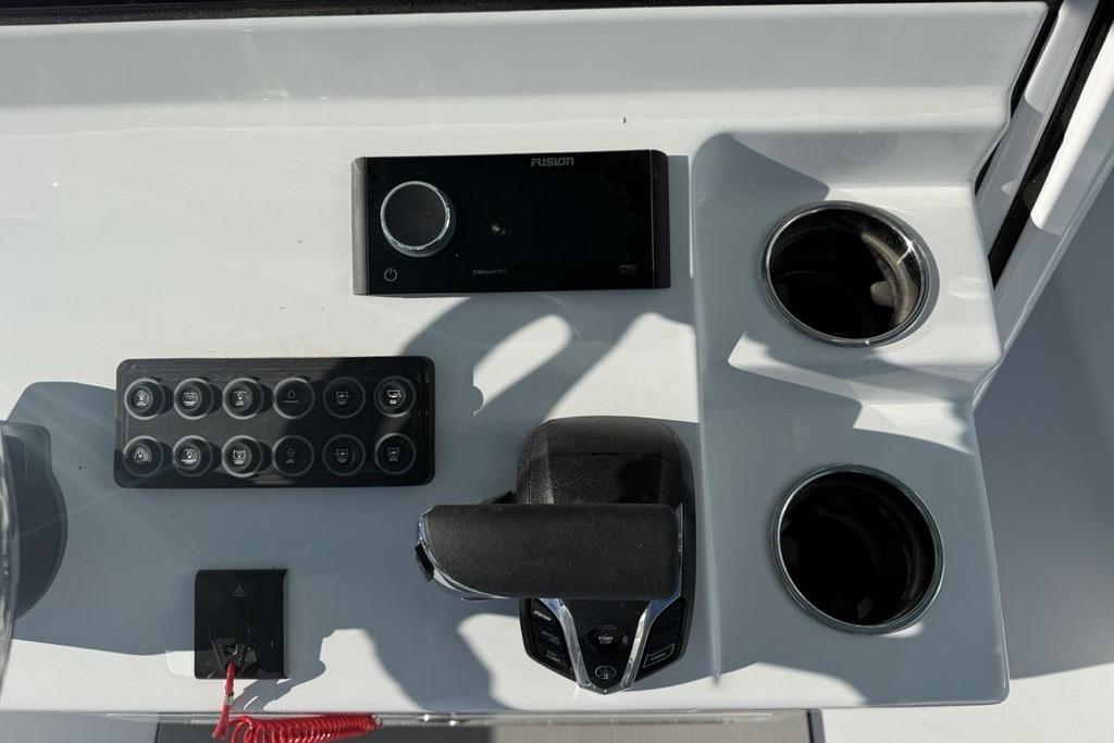 2026 Sportsman Masters 247OE Bay Boat console with controls and cup holders.