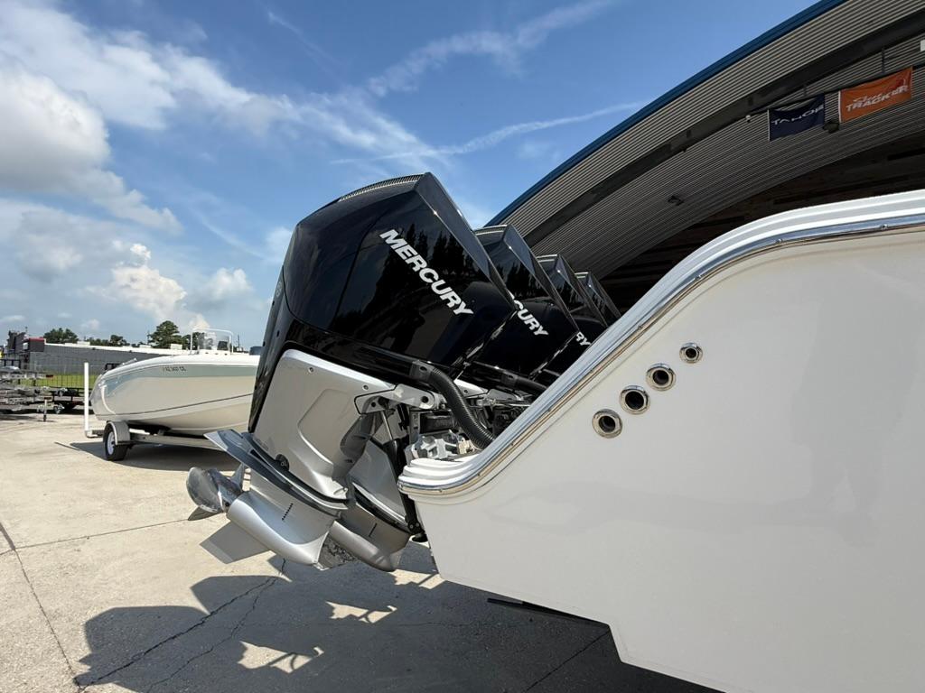 2024 Front Runner 39 CC boat with Mercury engines, docked under a clear blue sky.
