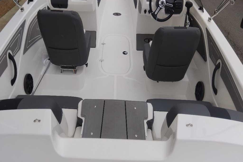 2026 Tahoe T21 boat interior with gray seating and modern dashboard design.