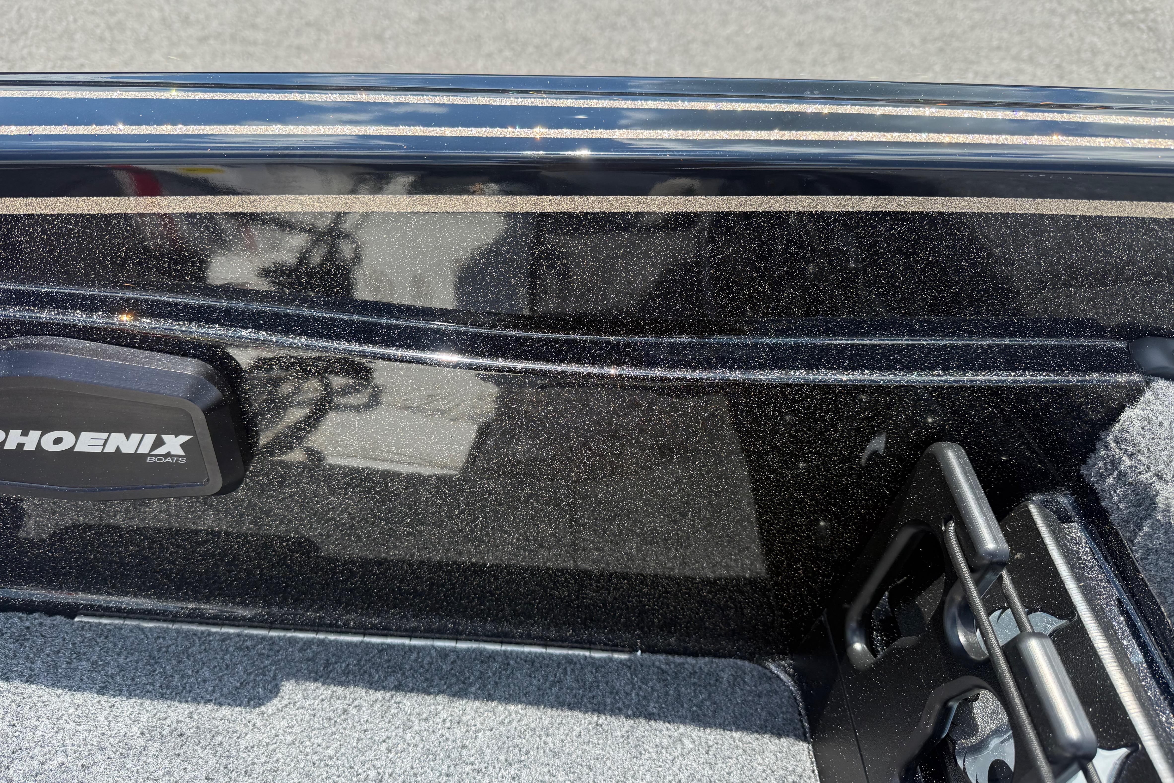 Interior view of a 2027 Phoenix 721 ZXL boat with sleek black finish.