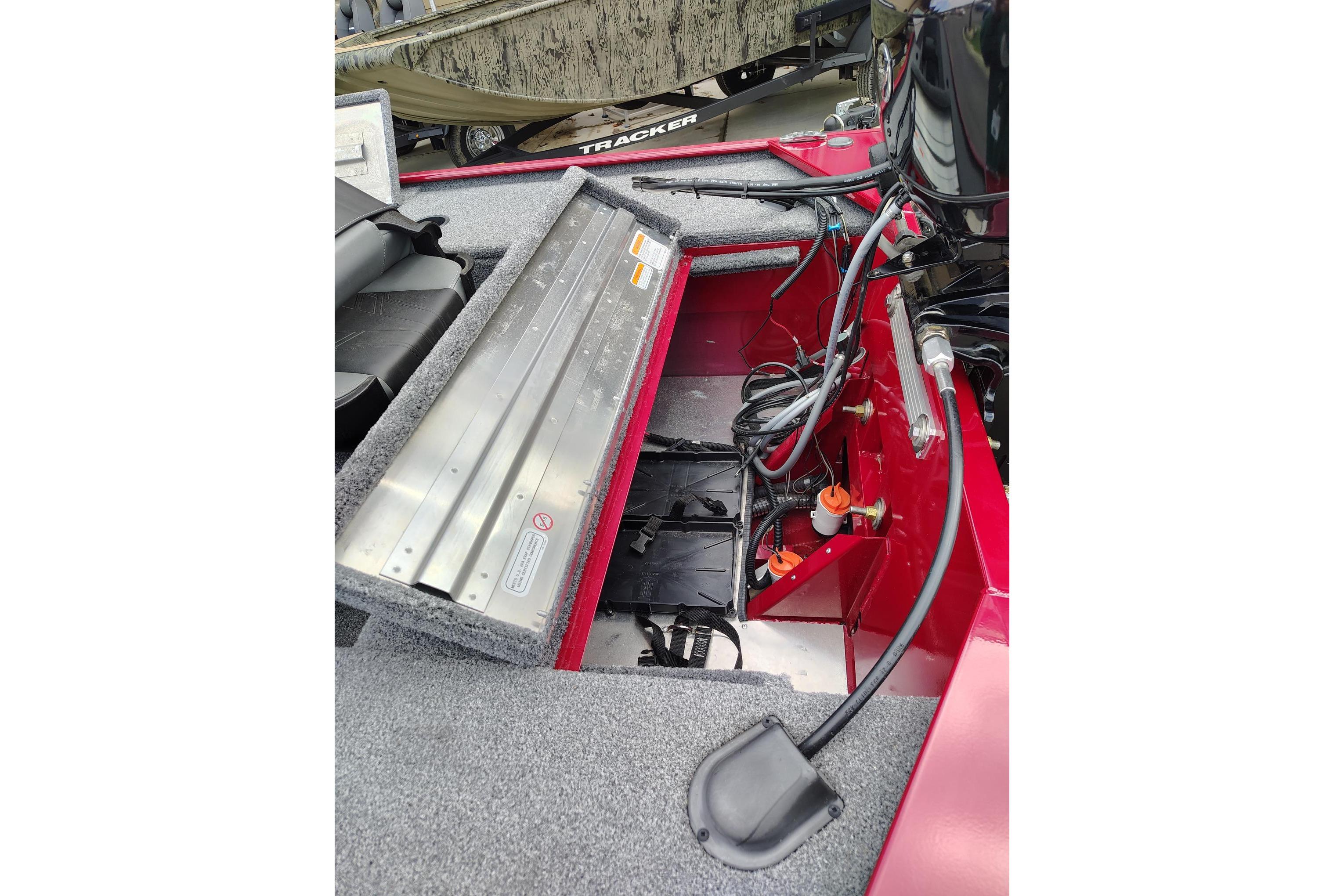 2025 Tracker Panfish 17 boat interior showing open storage compartment and wiring.
