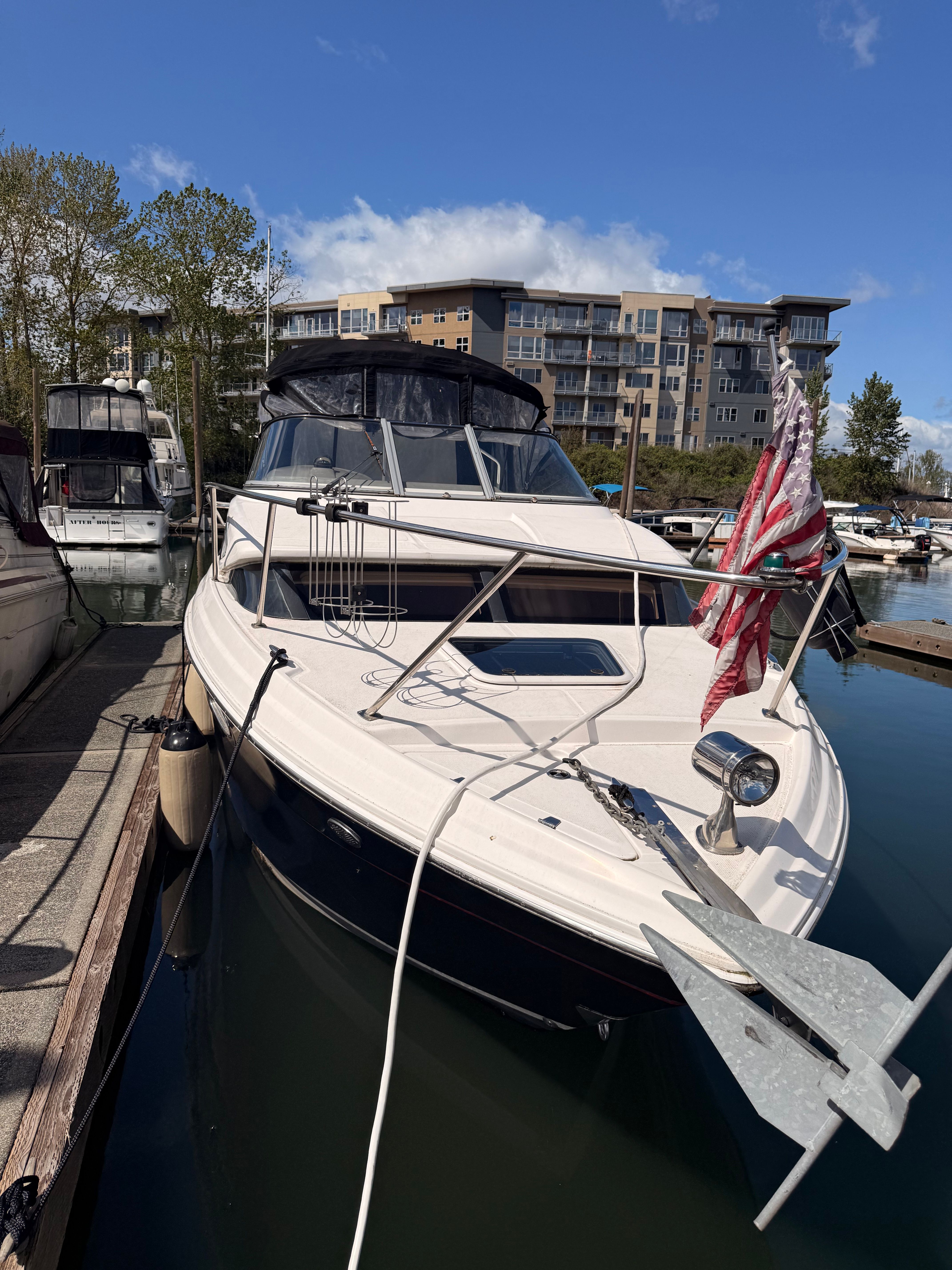 2008 Regal 2565 Window Express boat docked at marina.