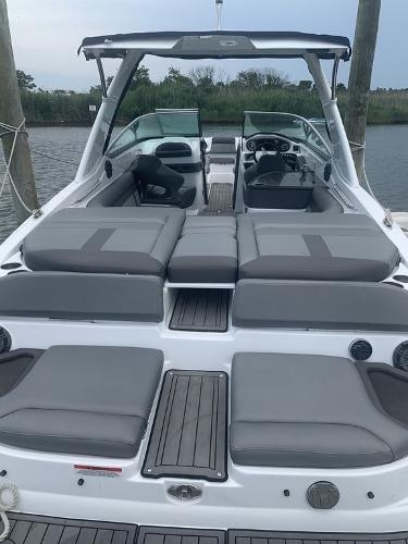 2020 Rinker 29QX BR boat with spacious seating and modern design.