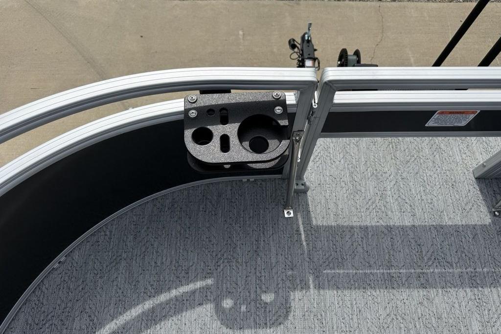 2026 Sun Tracker Bass Buggy 16 XL Select boat deck with cup holder and railing.