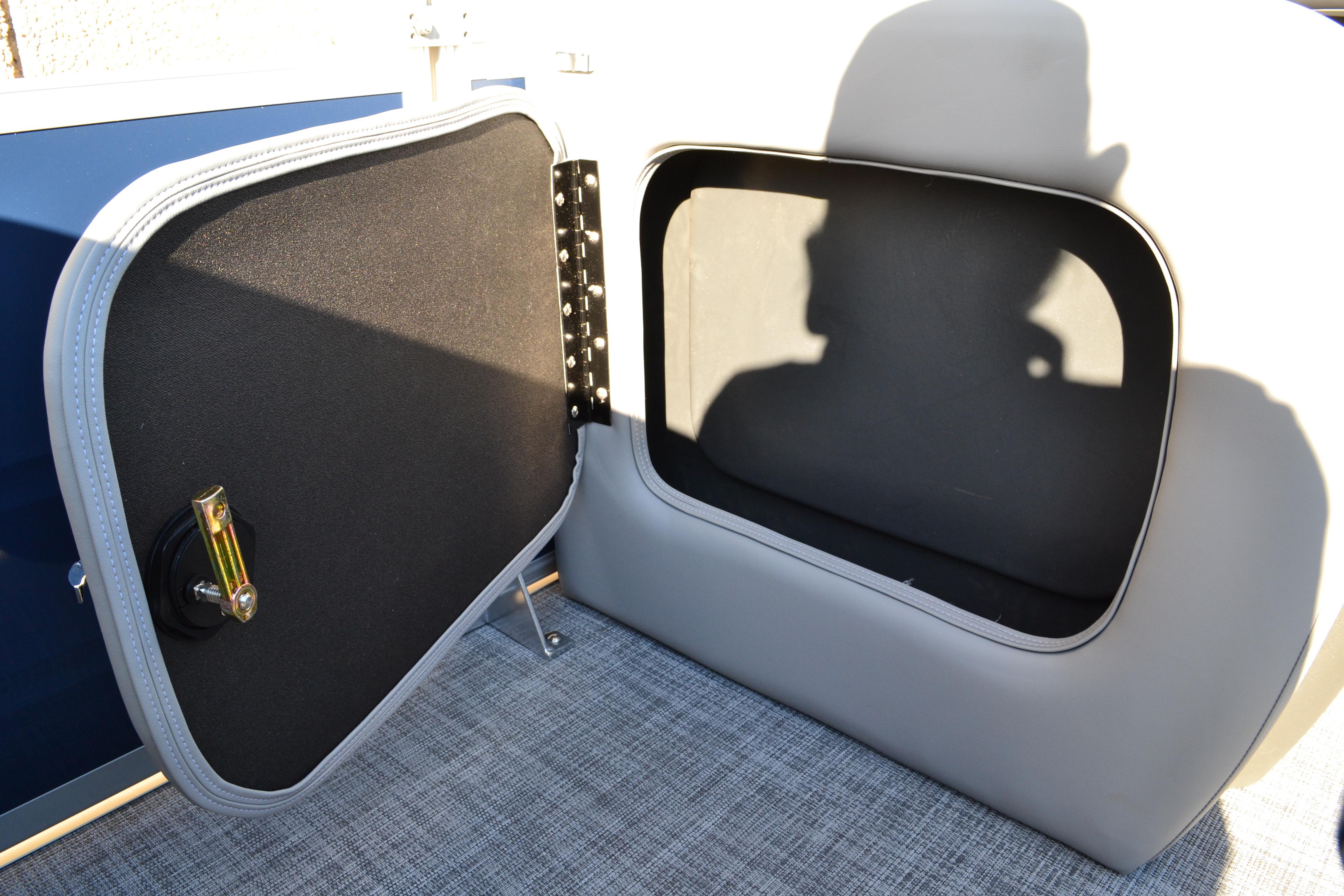 Open storage compartment on 2026 Sun Tracker SportFish 22 XP3 boat.