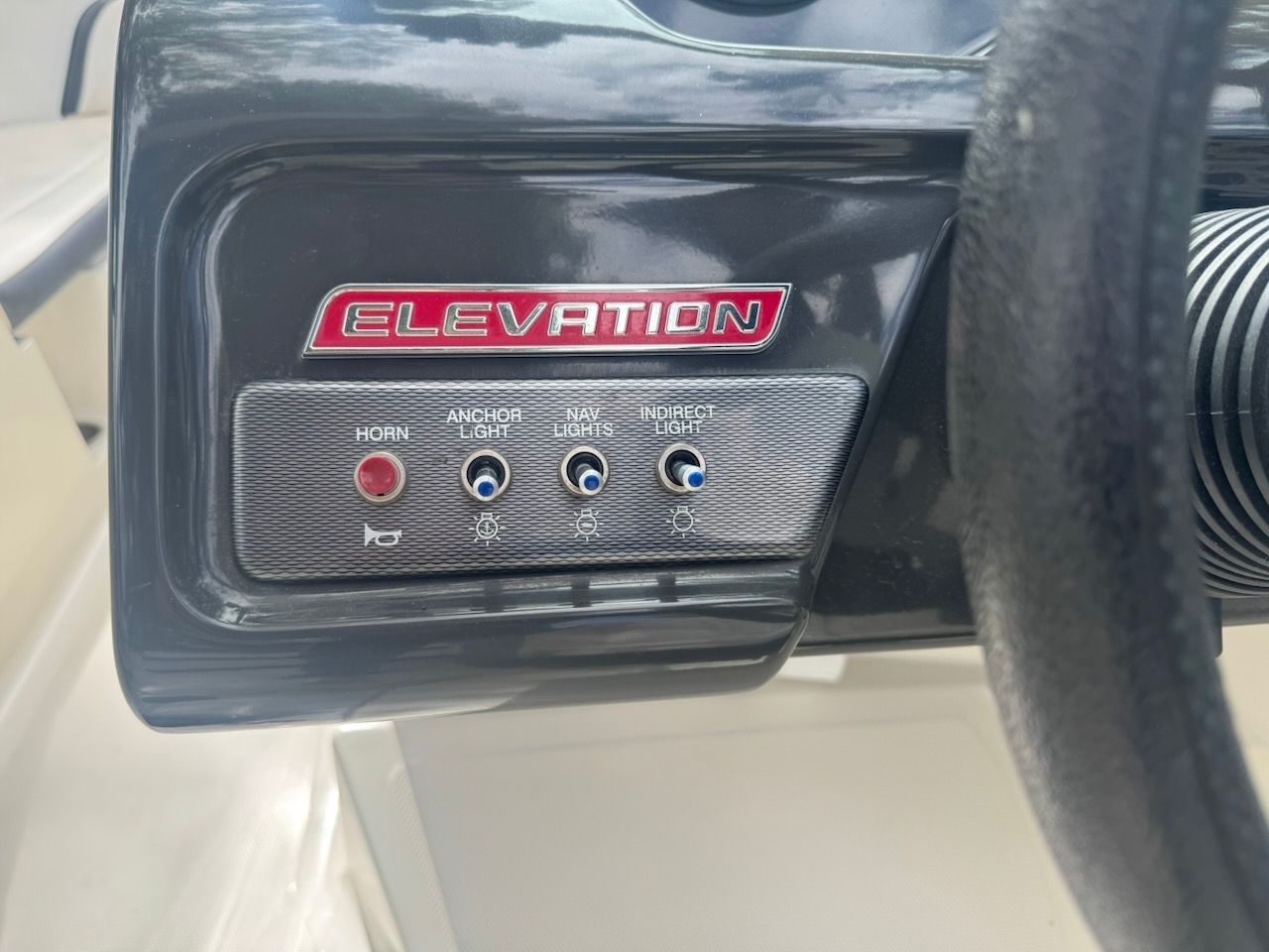 Close-up of the control panel with switches for horn and lights.