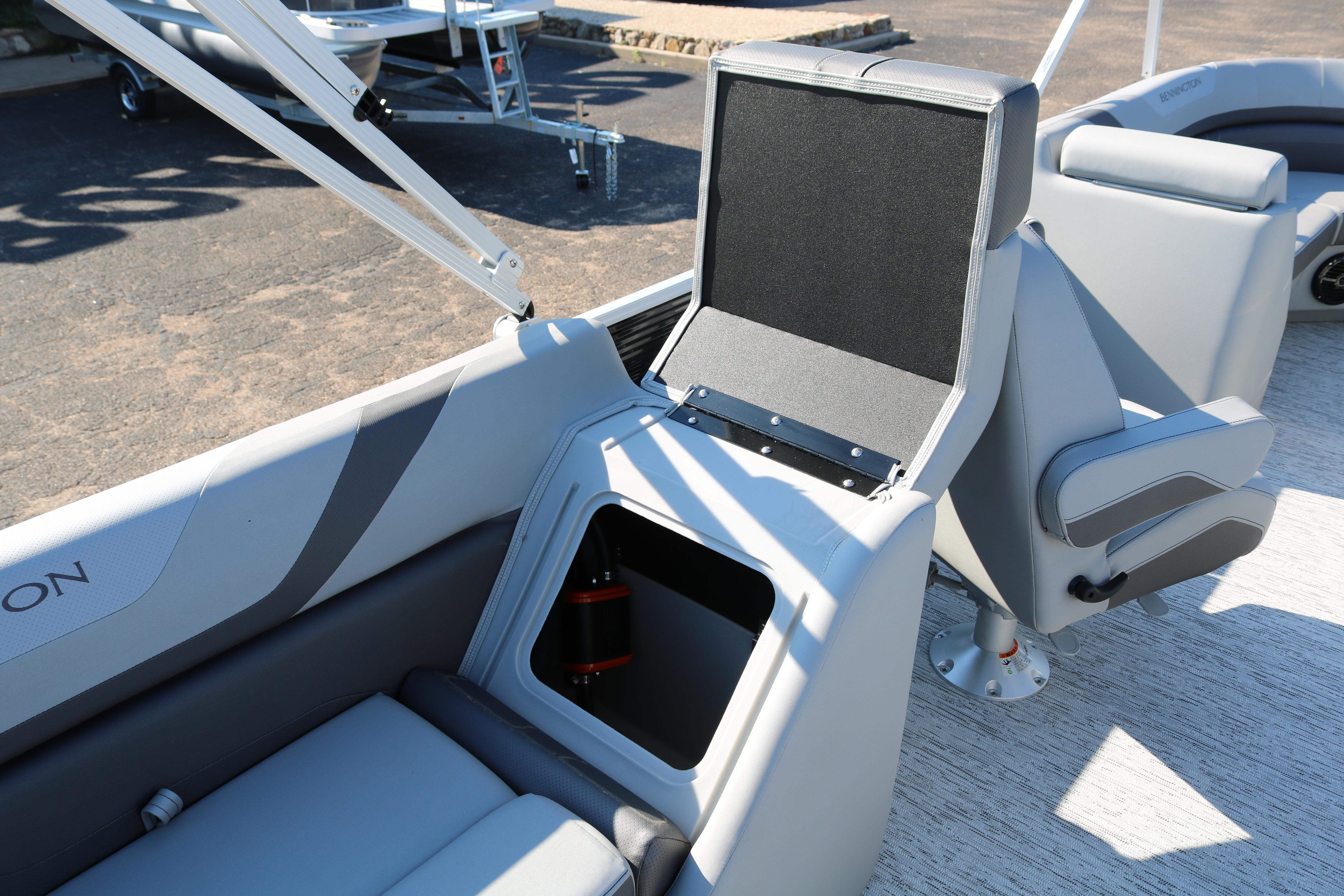 2026 Bennington 22SX Stern Radius boat interior with open storage compartment.