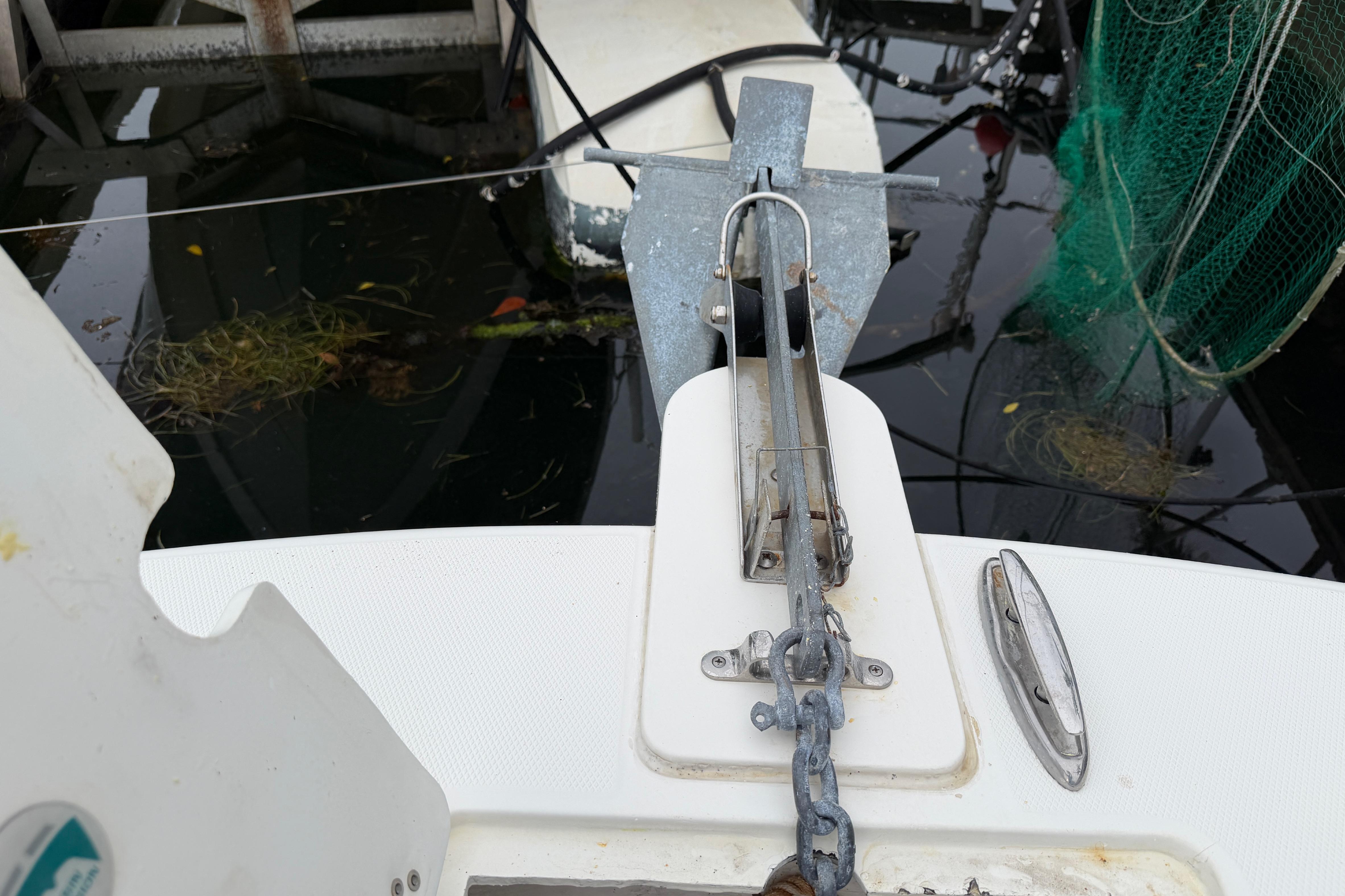 Anchor and chain on a 2019 World Cat 230 DC boat at dock.