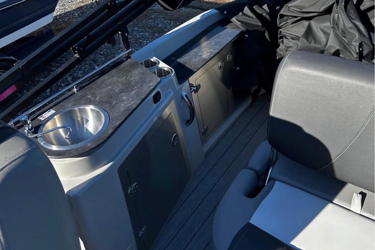 2023 Starcraft MX 25 DL DH boat interior with sink and seating area.