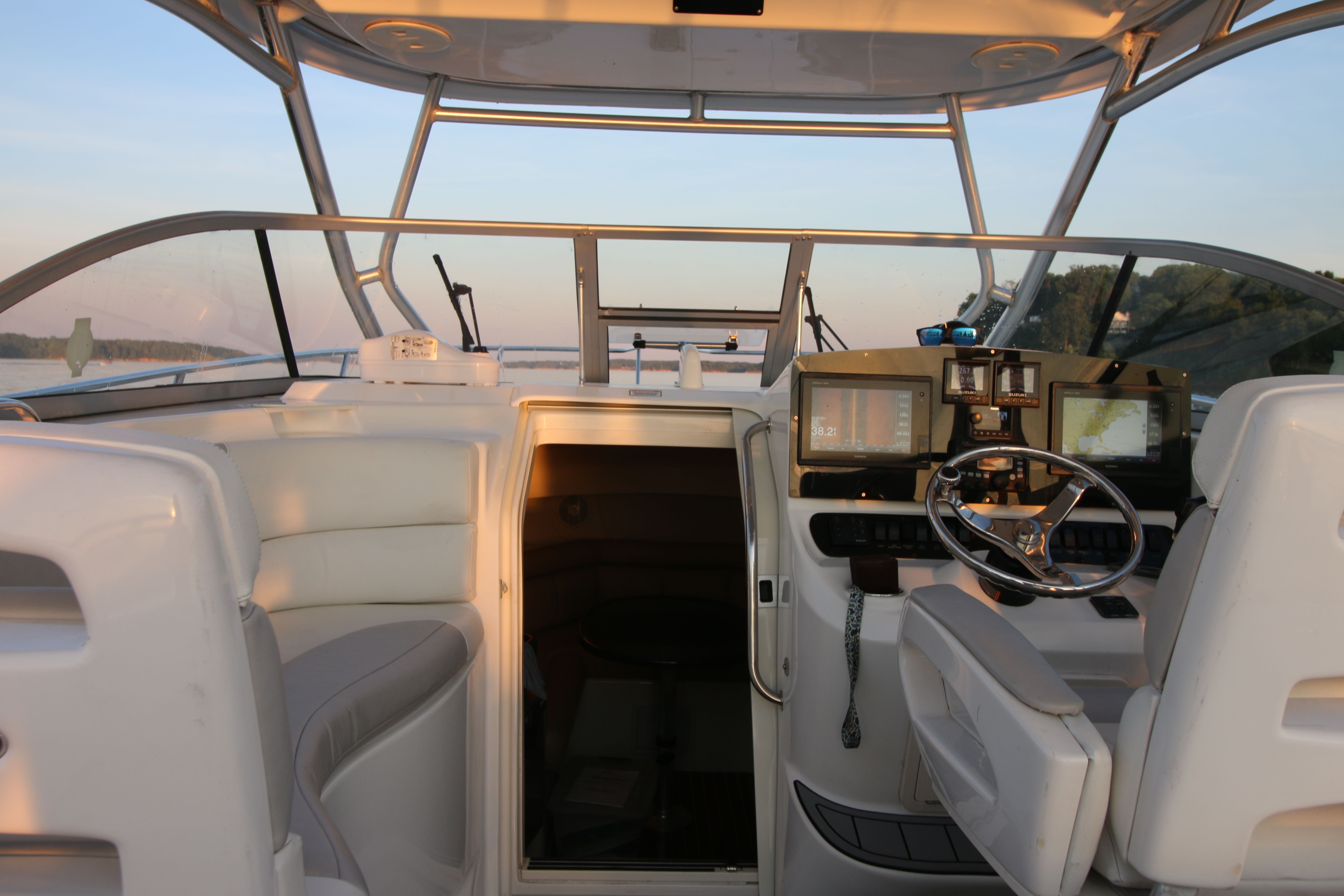 The cockpit of a 2006 Boston Whaler 305 Conquest with modern electronics and comfortable seating.