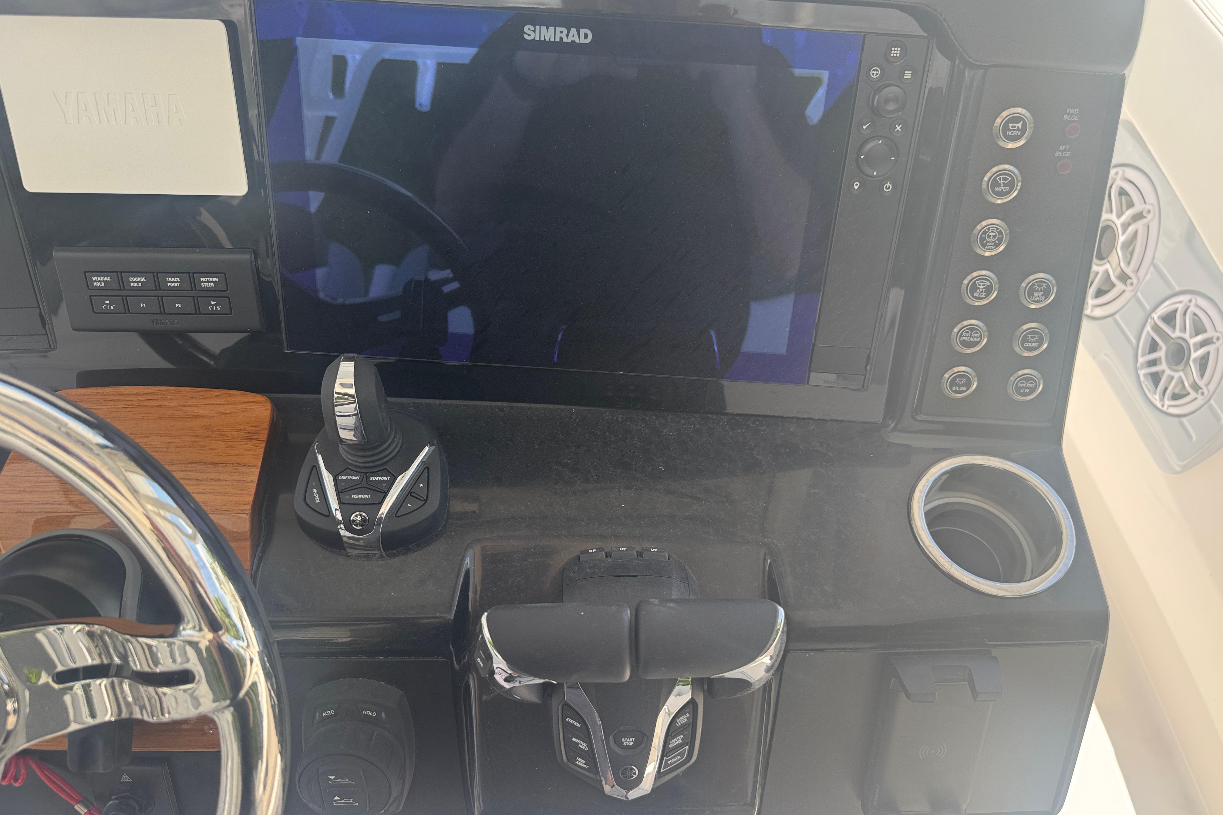 2025 Robalo R300 Center Console dashboard with Simrad display and controls.