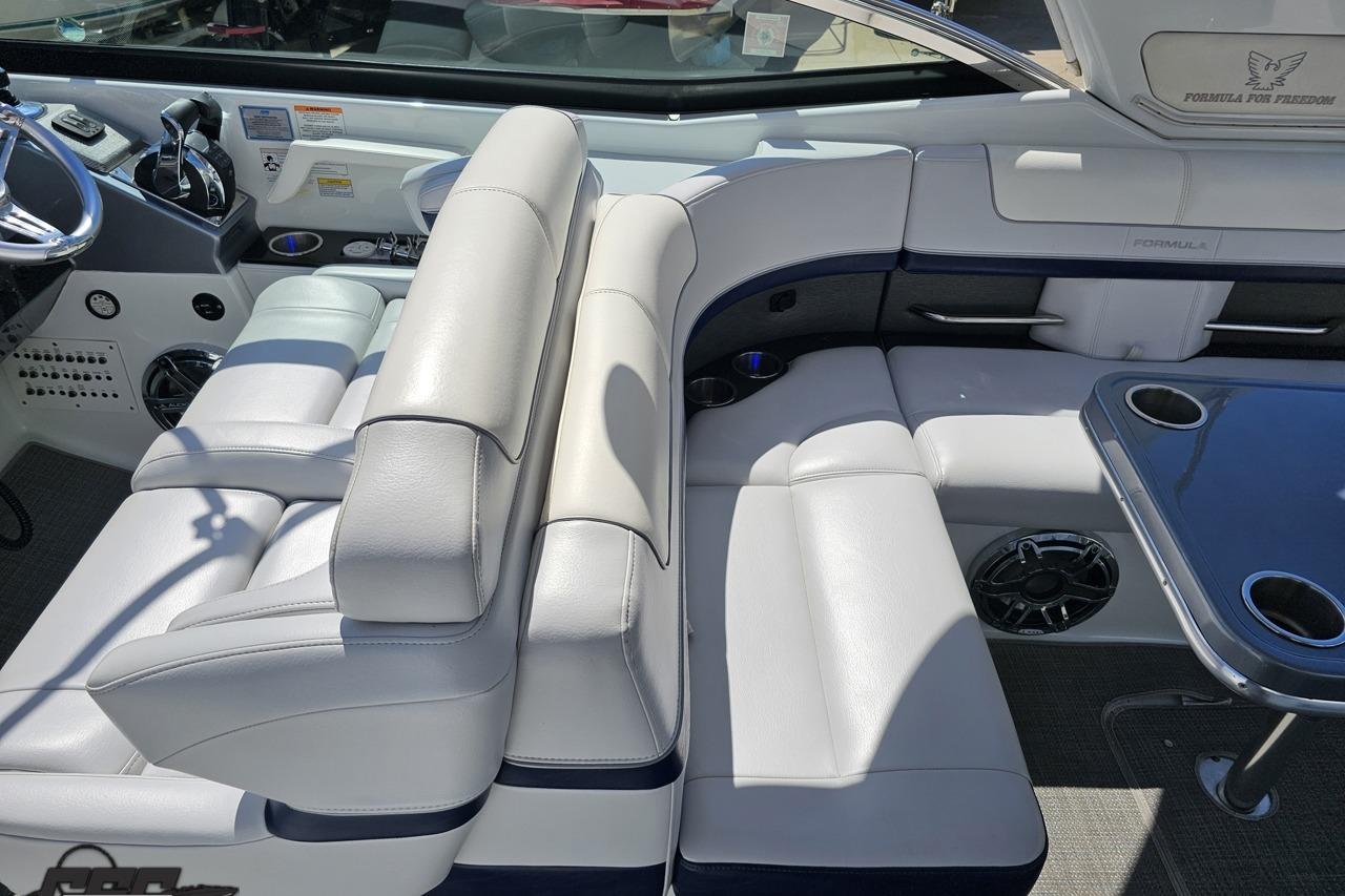 Luxurious interior of a 2015 Formula 350 Sun Sport boat with plush seating and sleek design.