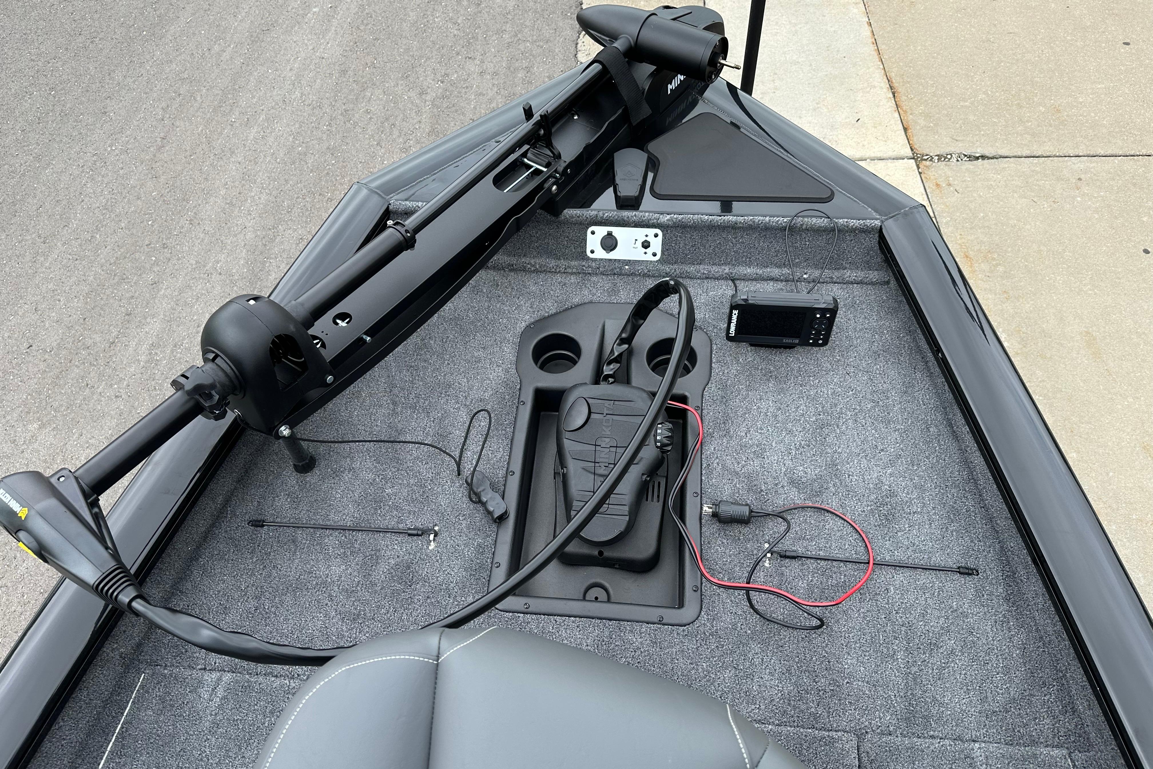2026 Tracker Pro Team 190 boat deck with trolling motor and control panel.