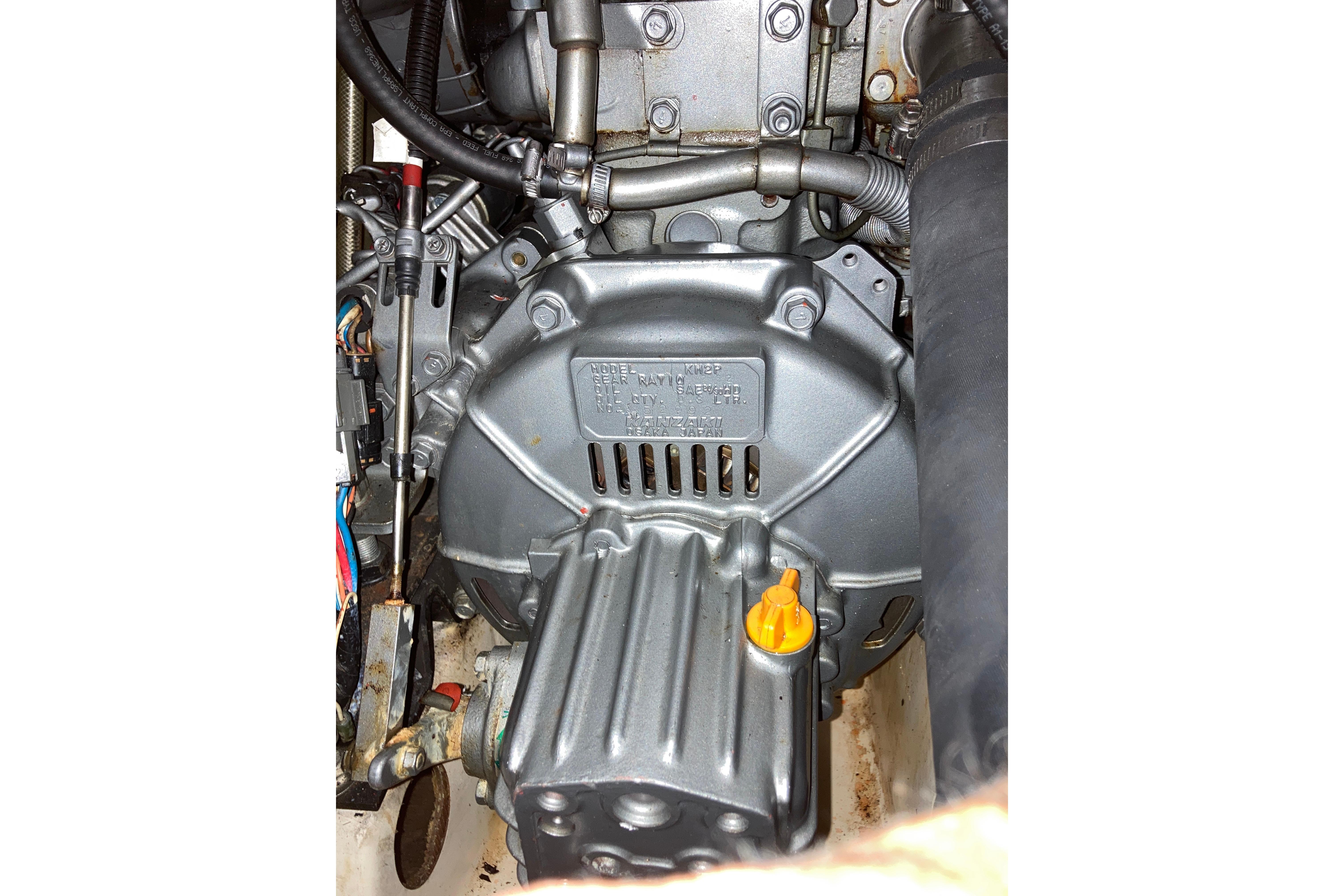 Engine compartment of a 2000 Beneteau Oceanis 321 sailboat, showcasing mechanical components.