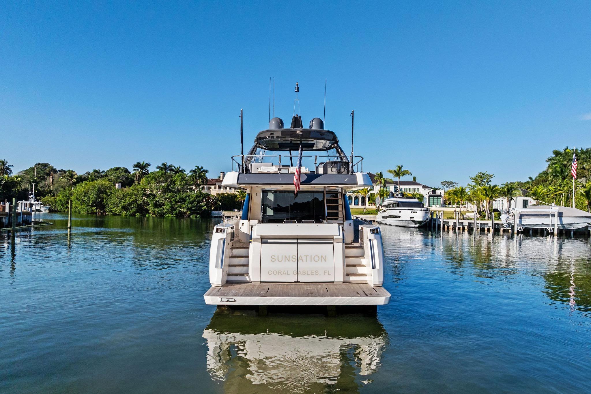 2019 Ferretti Yachts 780 docked in a serene marina setting.