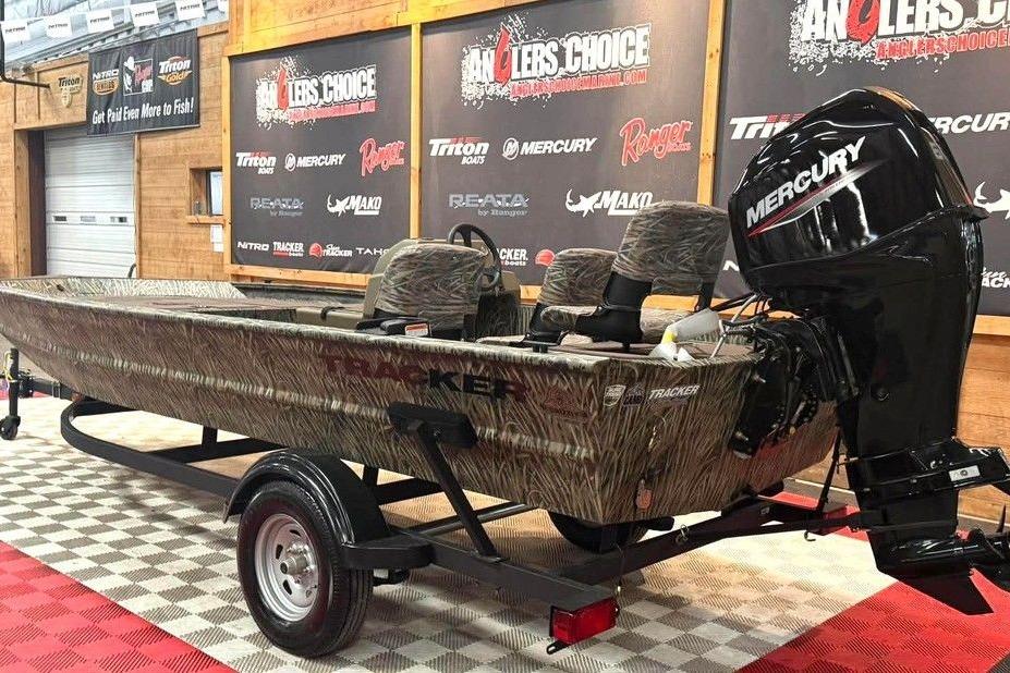 2026 Tracker Grizzly 1754 SC All-Welded boat with Mercury engine on display.