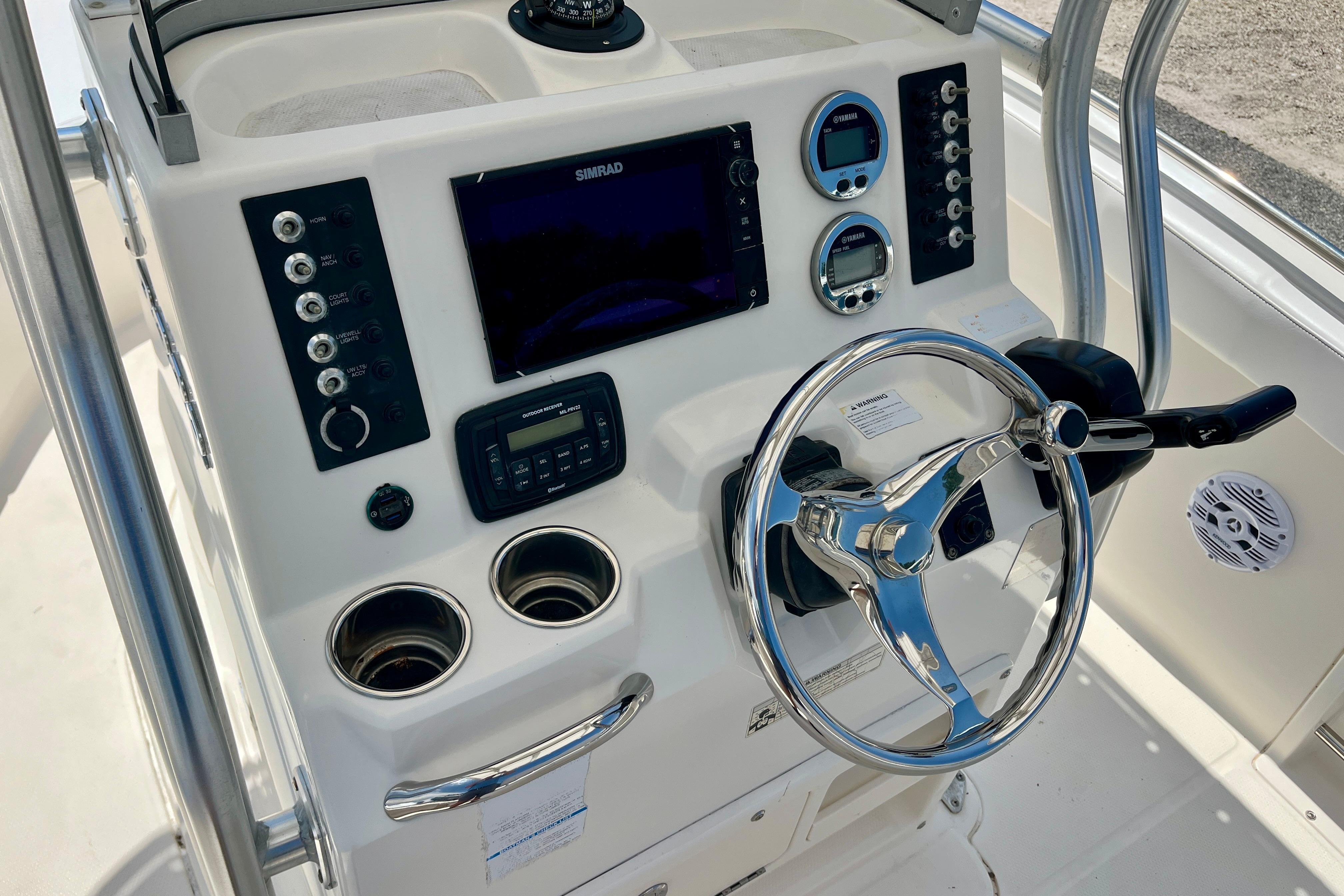 2016 Robalo R222 Center Console boat dashboard with steering wheel and navigation controls.