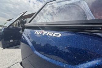 2026 Nitro ZV19 Sport Pro boat with sleek blue exterior and open door.