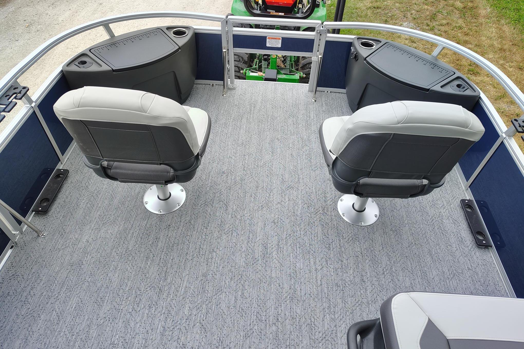 2026 Sun Tracker Bass Buggy 18 DLX interior with two swivel seats and storage compartments.
