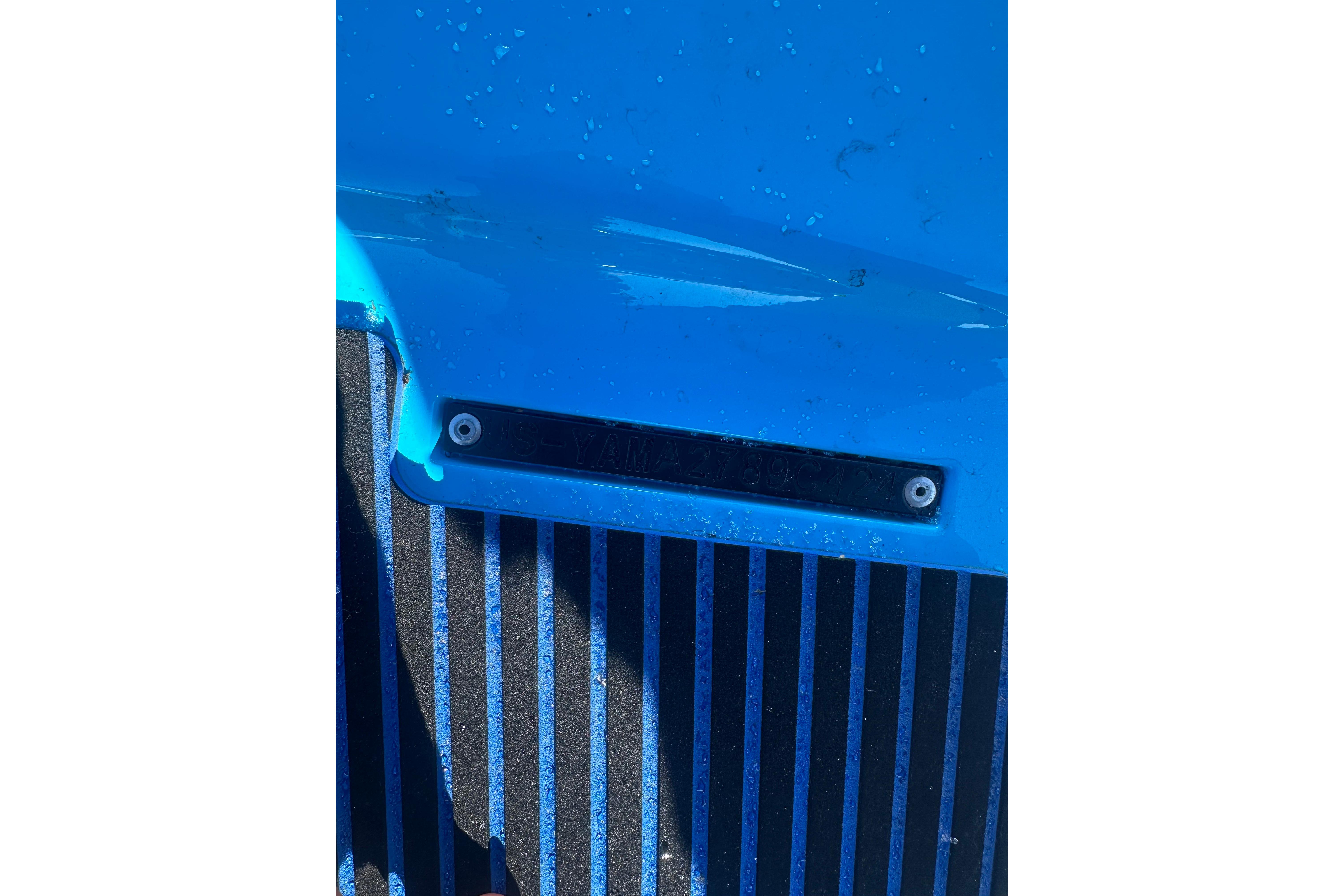 2024 Yamaha WaveRunner EX Sport, blue exterior detail with water droplets.