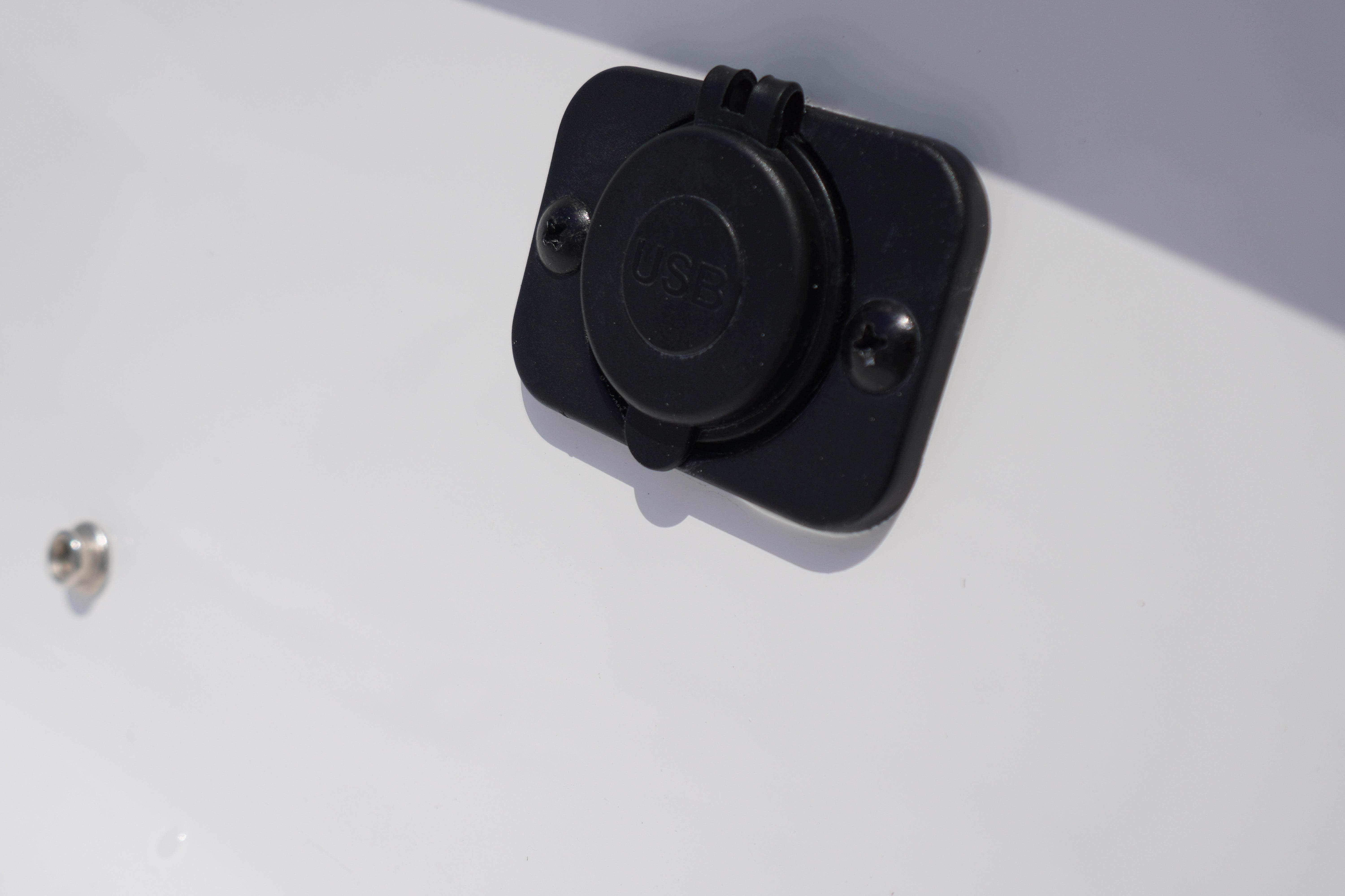 Close-up of a USB port on the 2027 Tidewater 220 CC Adventure boat.