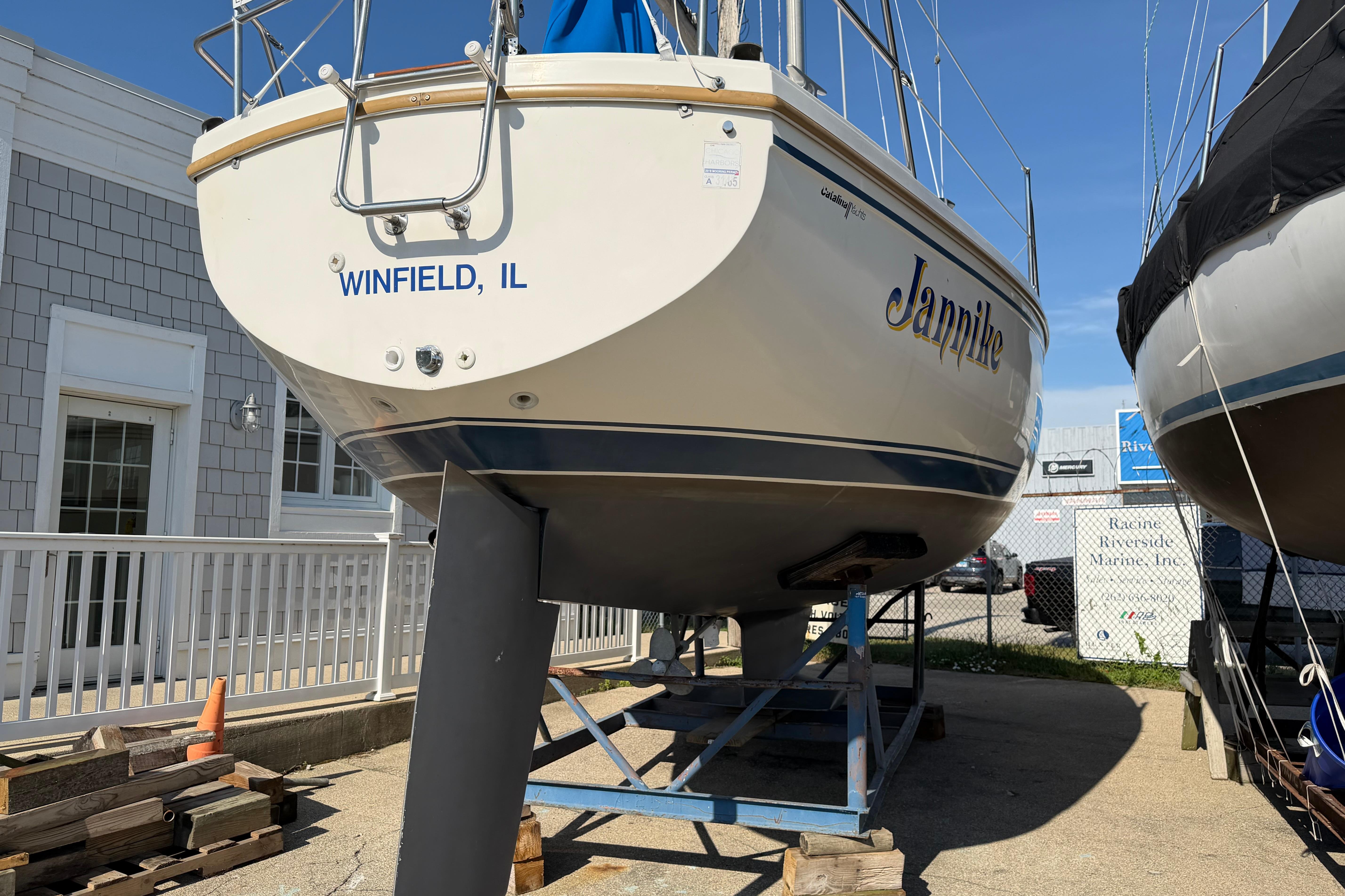 1988 Catalina 30 MkII sailboat "Jannike" from Winfield, IL, on a stand outdoors.