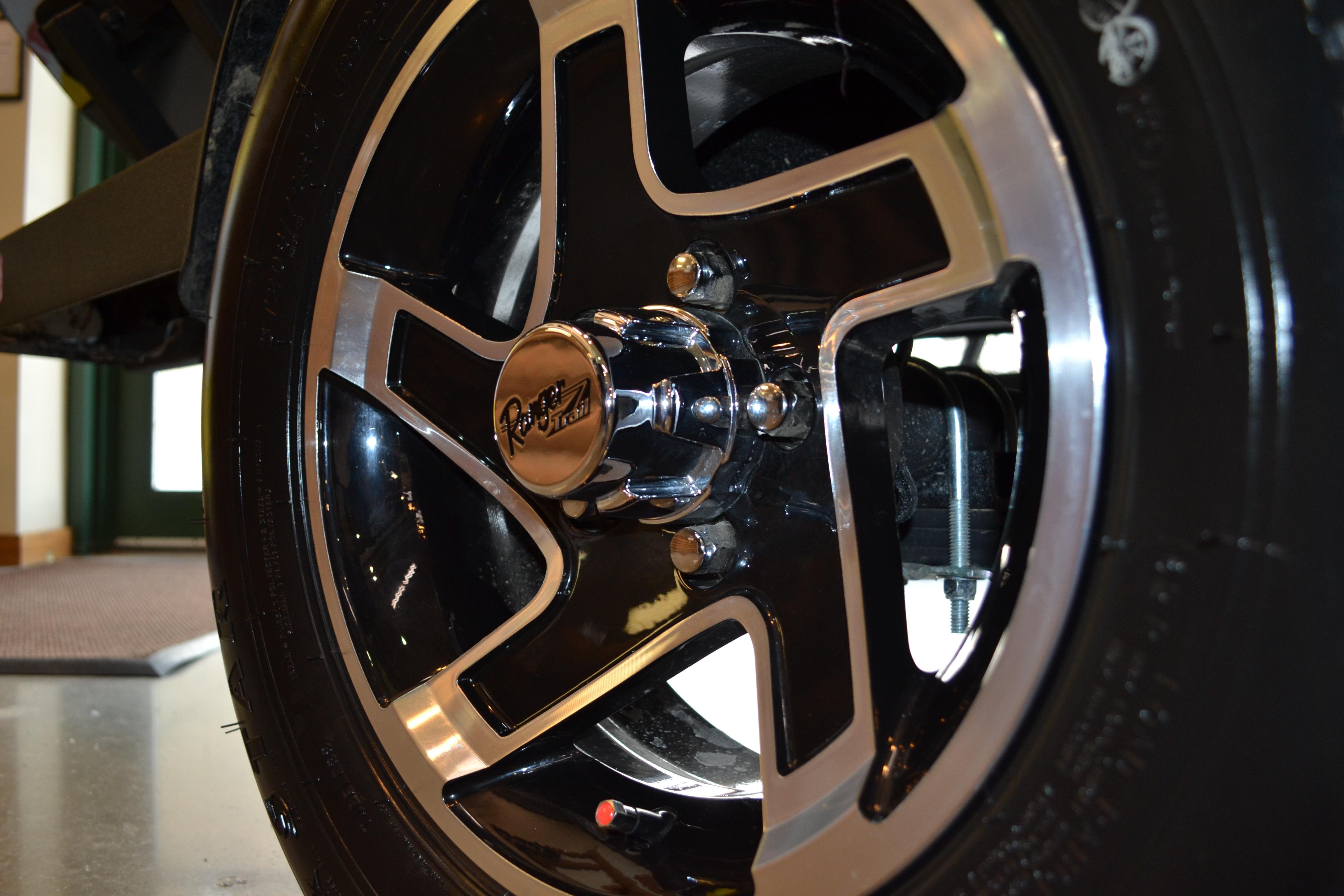 Close-up of 2026 Ranger RT178C wheel with sleek black and silver design.