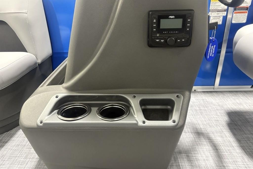 2026 Sun Tracker Party Barge 16 DLX console with cup holders and control panel.