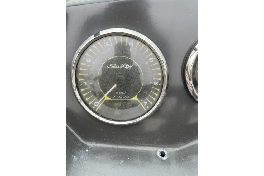 Close-up of a 2015 Sea Ray 210 SLX RPM gauge on a boat dashboard.