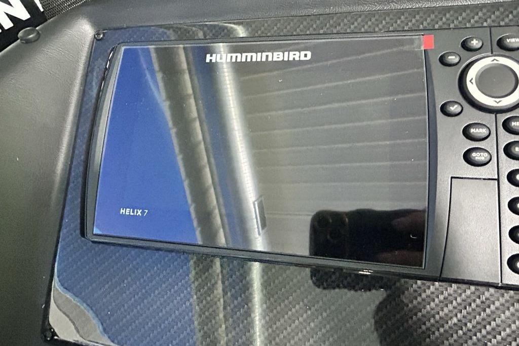 Humminbird Helix 7 fish finder on 2026 Phoenix 818 Pro dashboard.