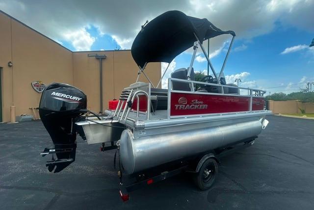 2026 Sun Tracker Bass Buggy 16 XL Select pontoon boat with Mercury outboard motor.