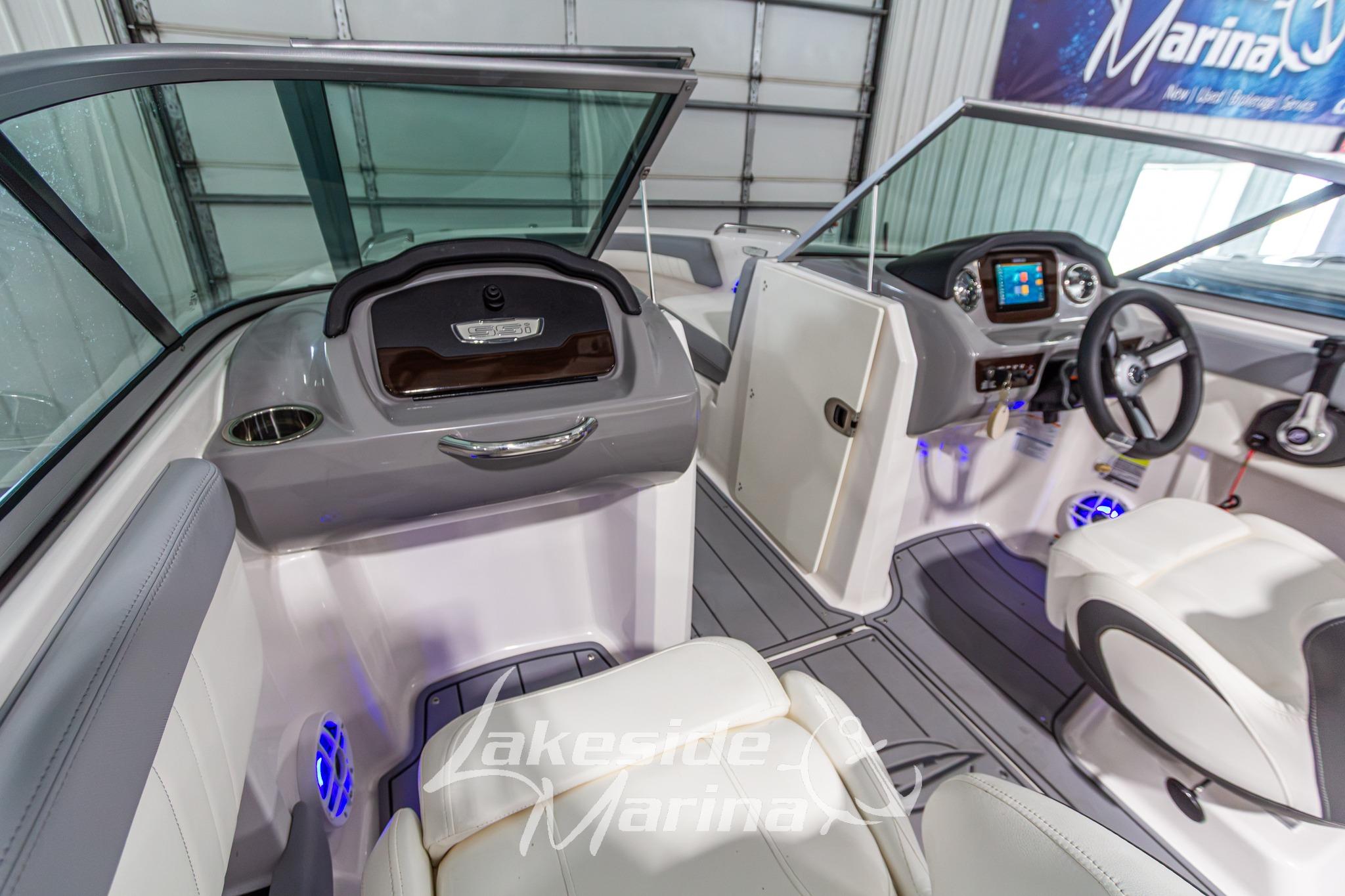 Interior of 2022 Chaparral 21 SSi boat with modern dashboard and seating.