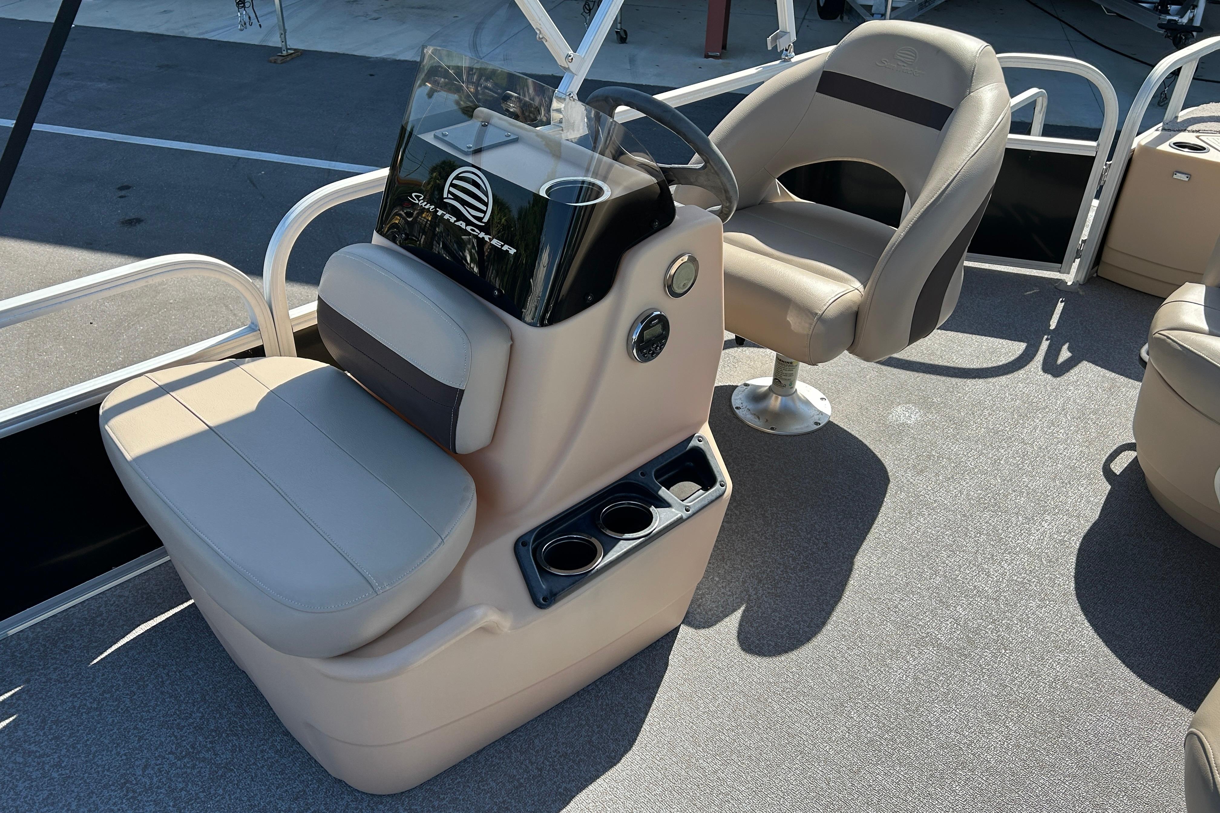 2017 Sun Tracker Bass Buggy 18 DLX boat interior with steering console and seating.