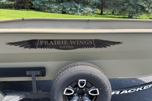 2026 Tracker Grizzly 1650 T Prairie Wings Edition boat with distinctive logo and tire detail.