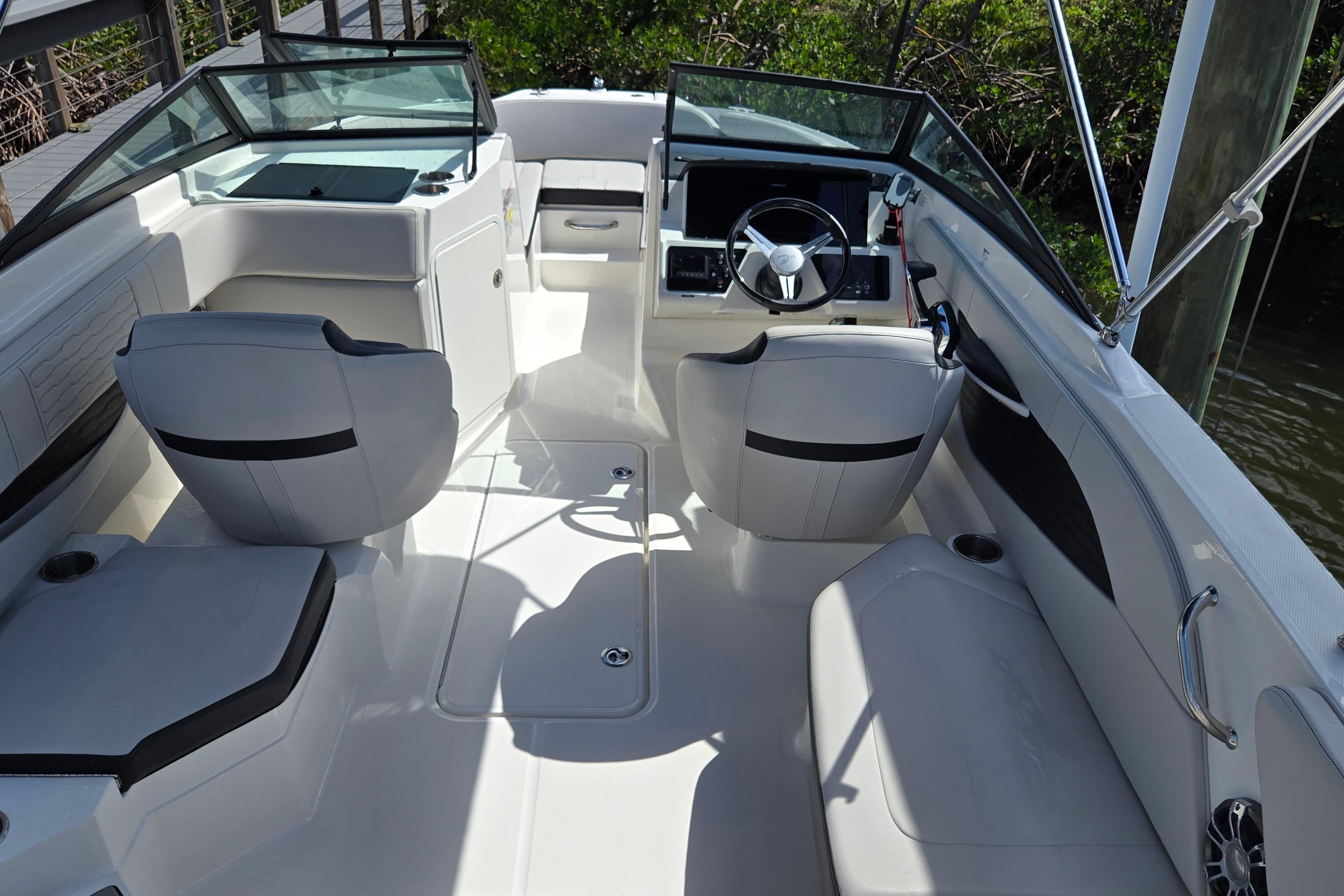 2023 Sea Ray SPX 210 boat interior with modern seating and steering console.