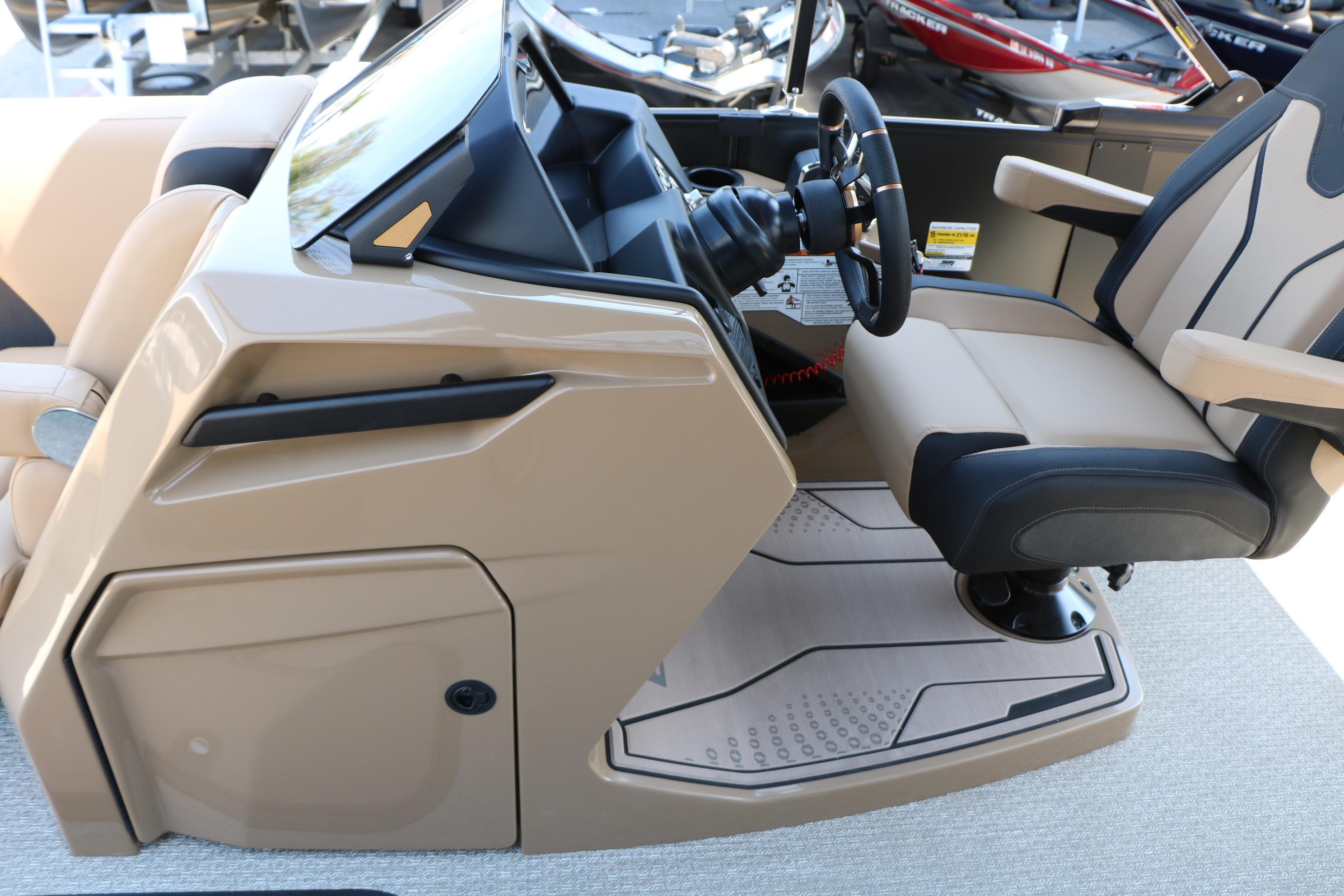 Helm of 2026 Evotti 725 CS Tri-Toon with modern steering and seating.