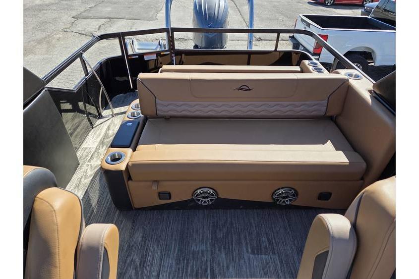 2026 SunCatcher Diamond Elite 326 SL boat interior with tan seating and cup holders.