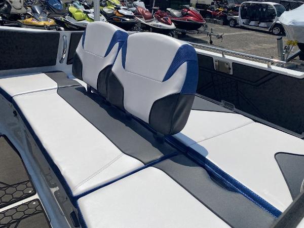 2021 Scarab 255 Open ID boat interior with white and blue seating.