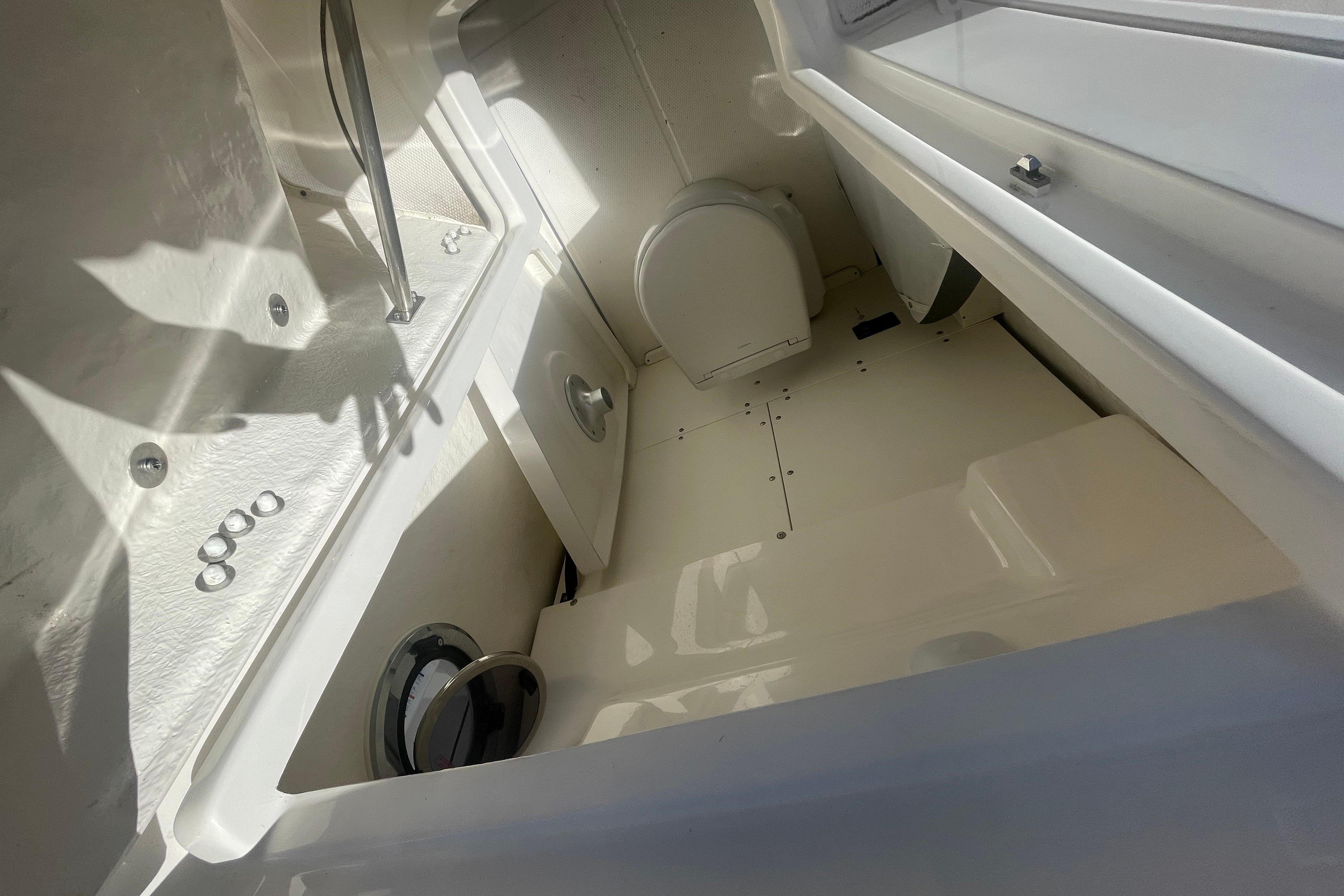 2023 Robalo R270 Center Console interior cabin with storage compartments.